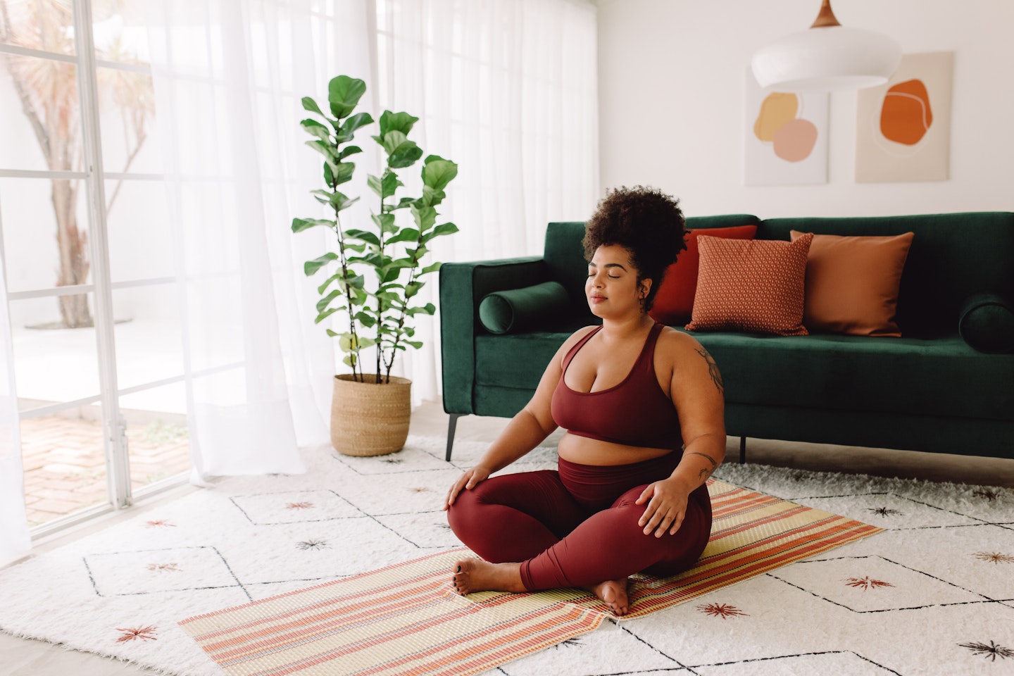 Woman doing Yoga in living room