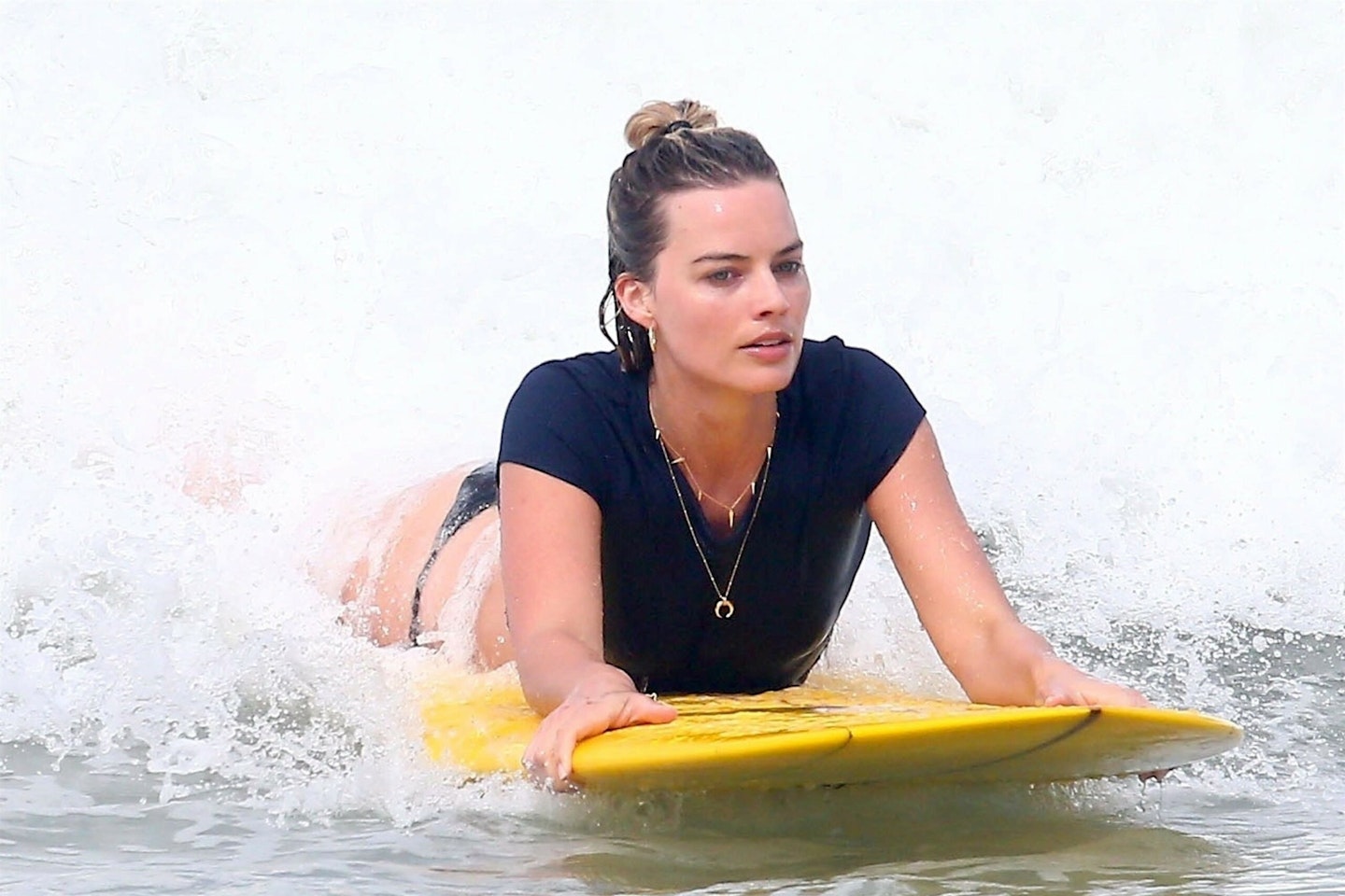 Margot Robbie surfing
