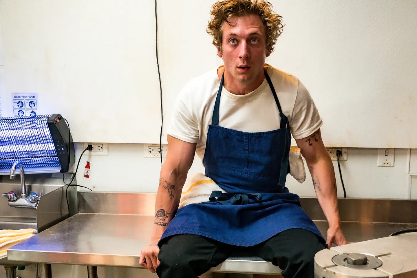 Jeremy Allen White as Carmy Berzatto in his signature white T-shirt on FX’s The Bear.