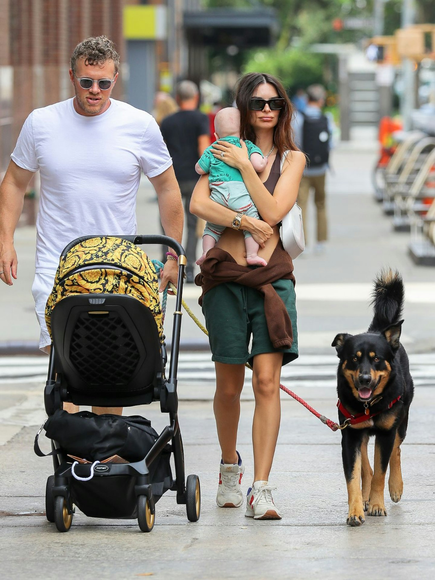 Emily Ratajkowski is seen out for a walk with baby pram and family