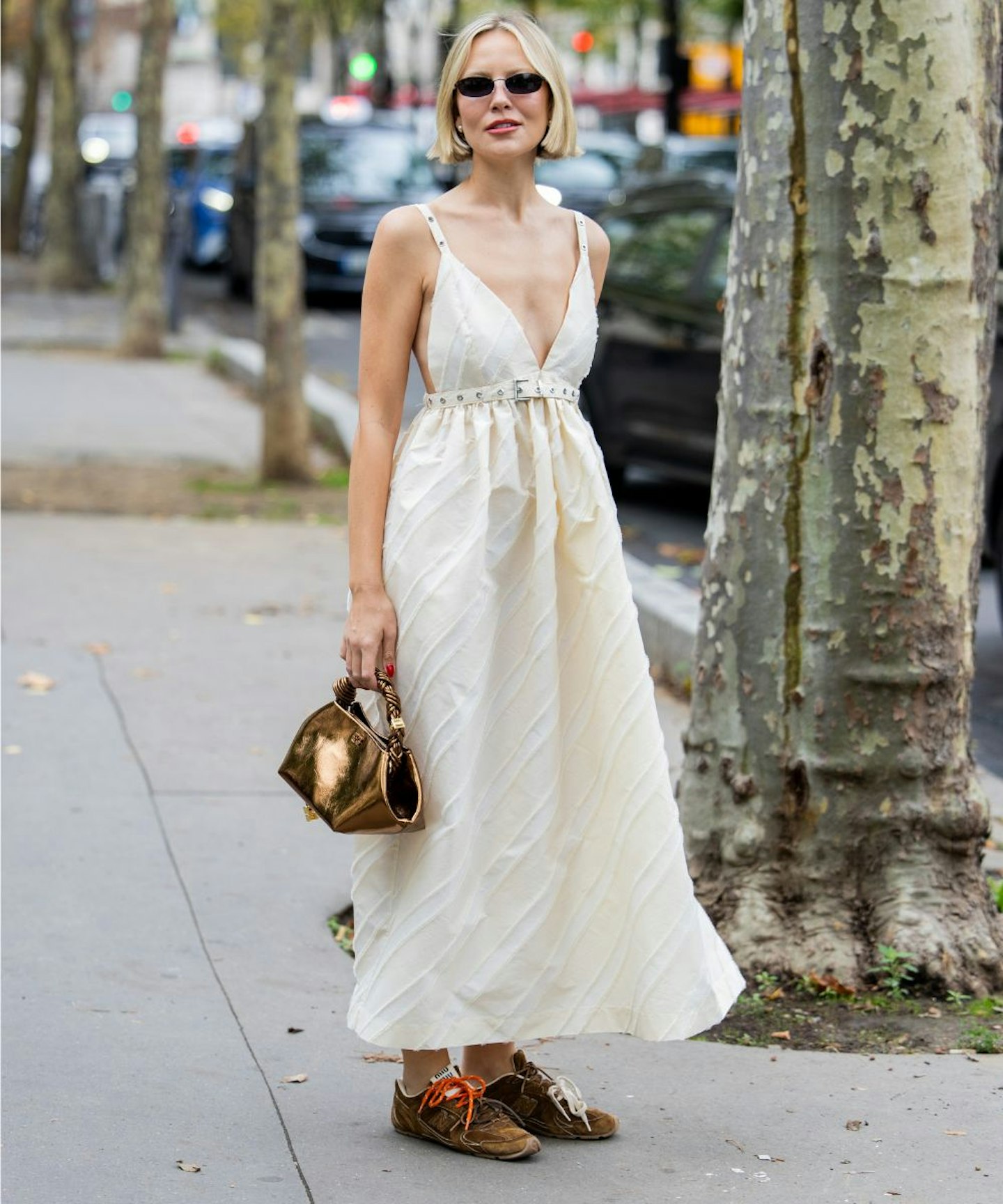 Violet Grace Atkinson wearing suede trainers with a ganni dress