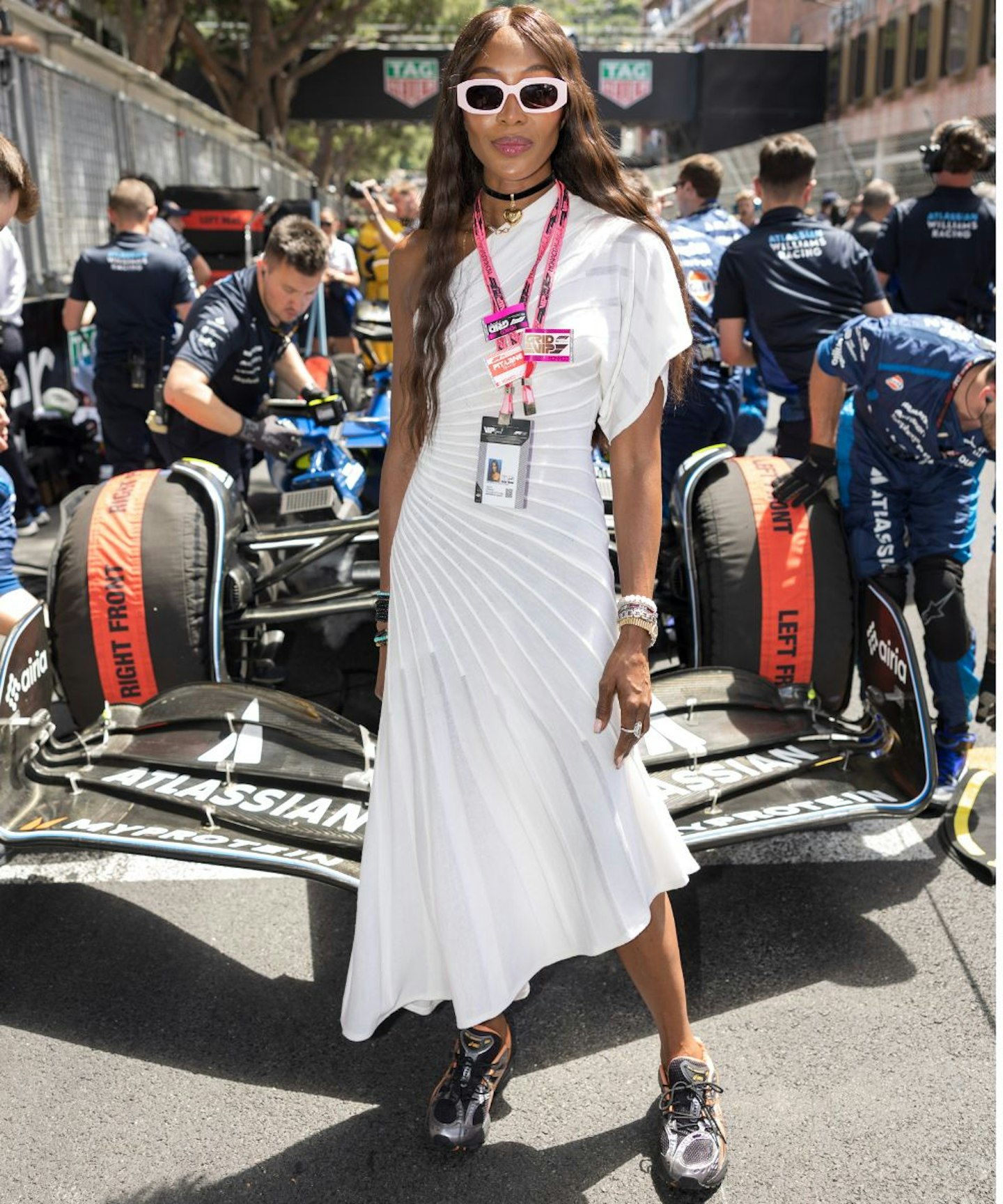 Naomi Campbell attends the F1 Grand Prix Of Monaco wearing a white dress and asics trainers