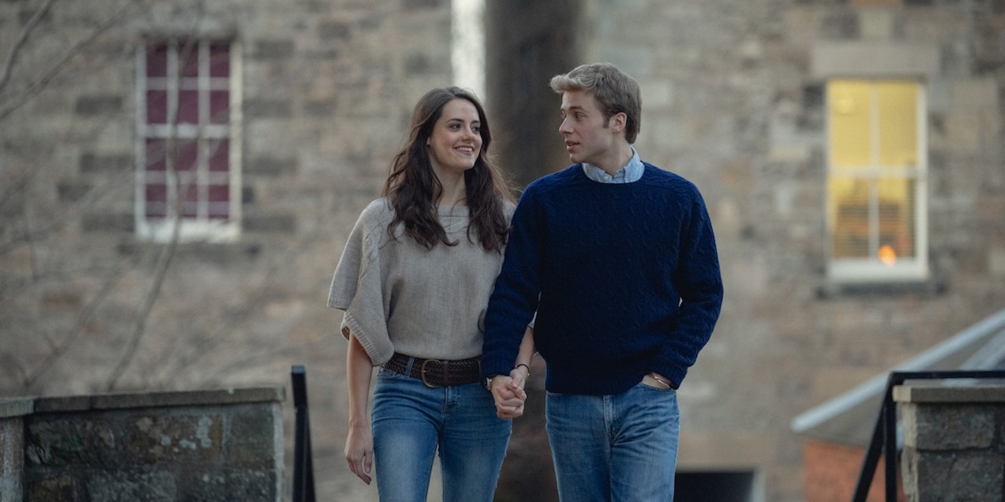 Actors Kate Bellamy and Ed McVey hold hands as Princess Kate and Prince William in The Crown