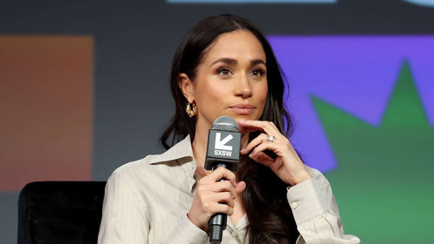 Meghan Markle holding a microphone while speaking at SXSW