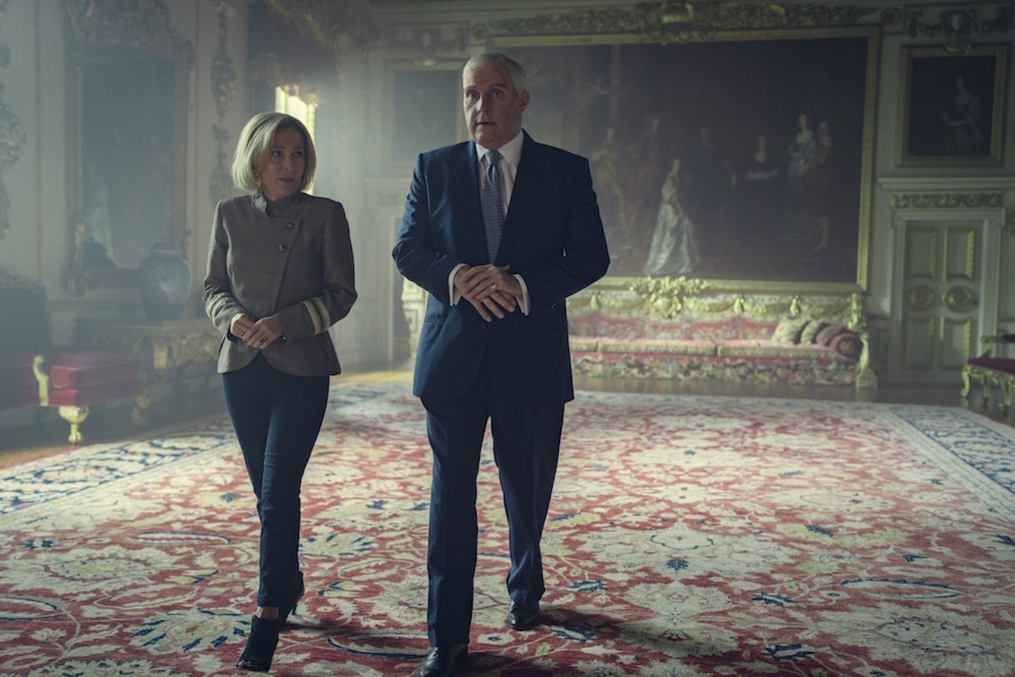 Prince Andrew (Rufus Sewell) gives Emily Maitlis (Gillian Anderson) a tour of the palace