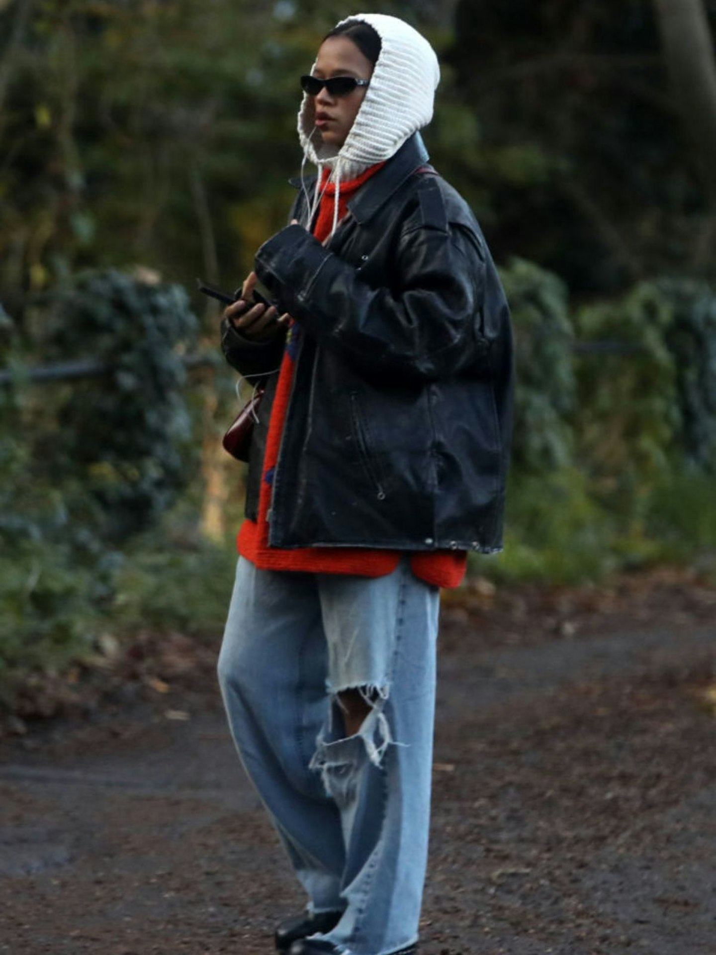 Taylor Russell walking wearing baggy jeans in London, Nov 2023
