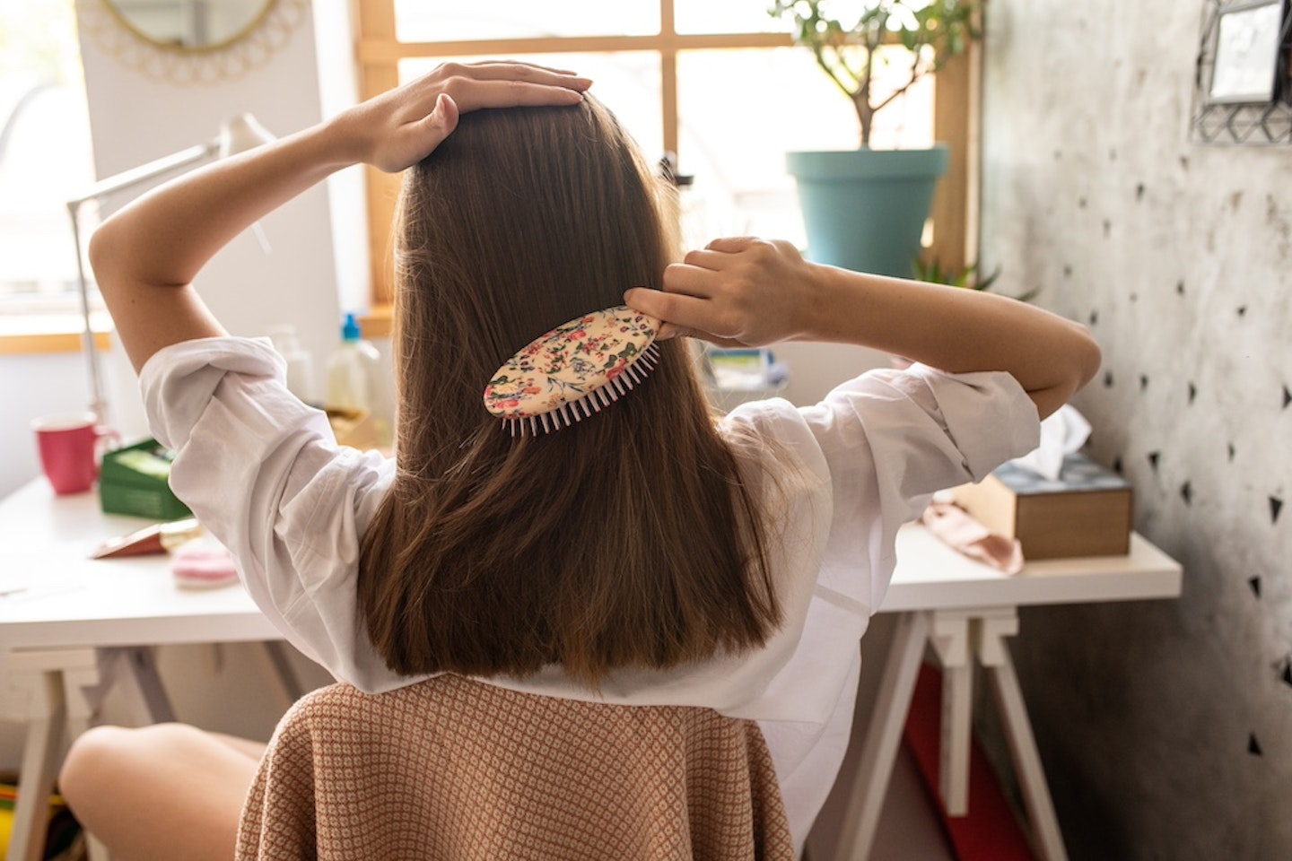 Woman brushing hair