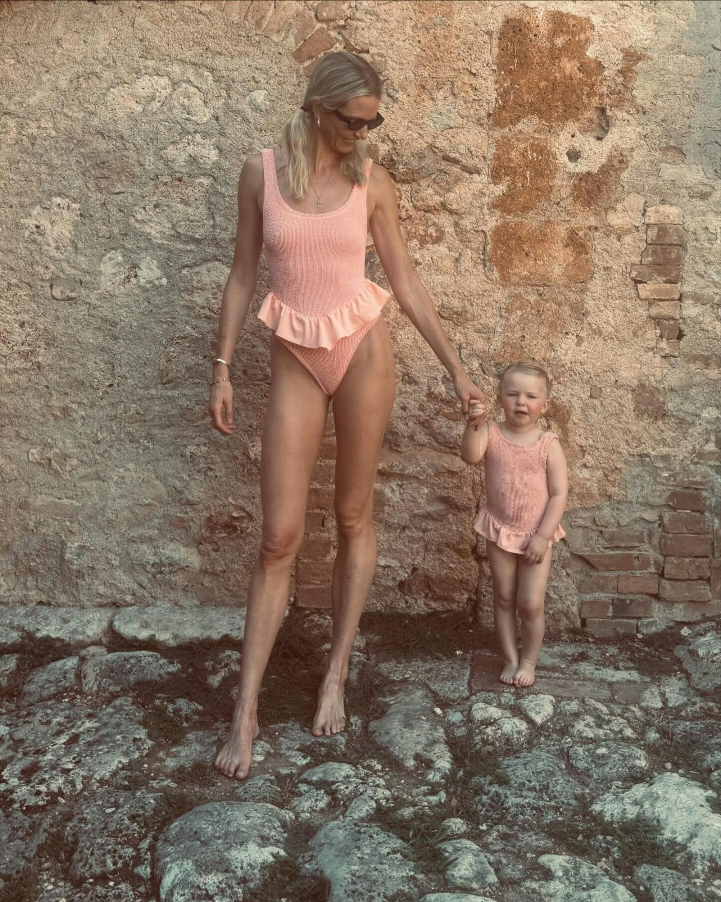 Georgiana Huddart with her daughter in matching Hunza G swimsuits