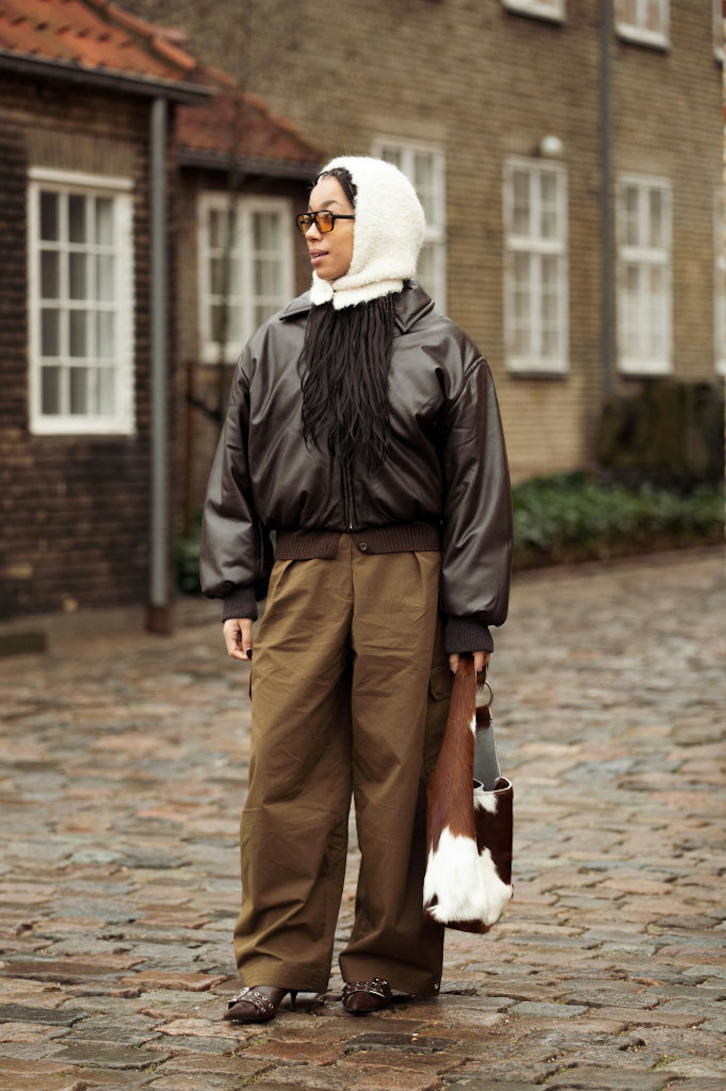 Amaka Hamelijnck with a cow print bag