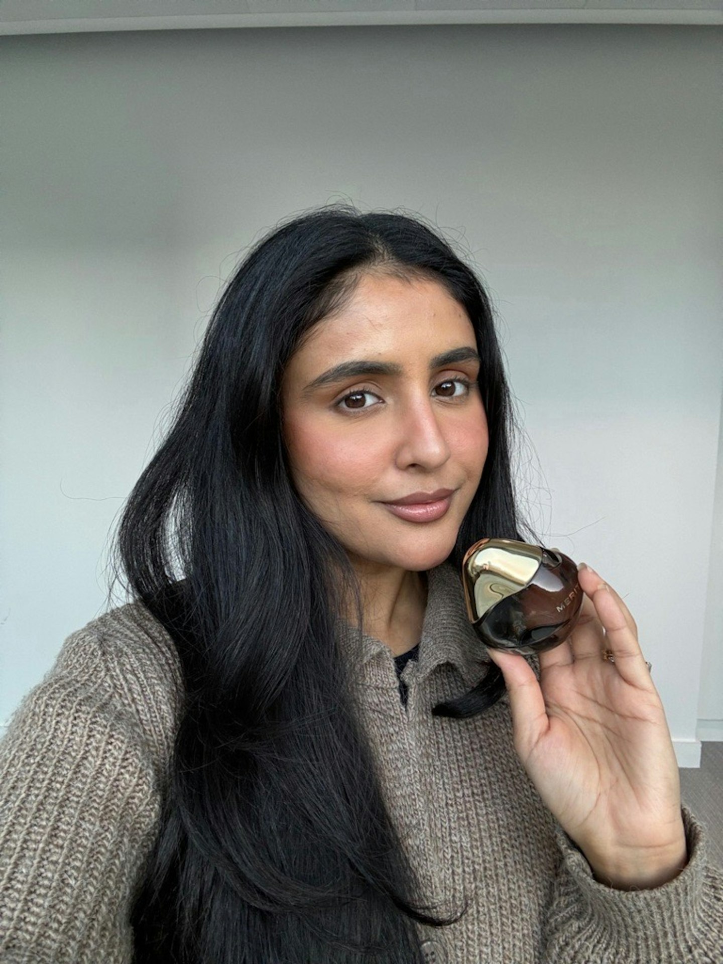 Beauty writer Sameeha Shaikh testing Merit's Retrospective perfume