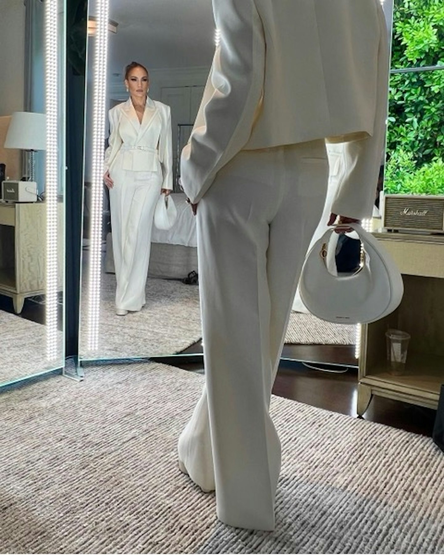 Jennifer Lopez wearing Charles & Keith crescent hobo bag