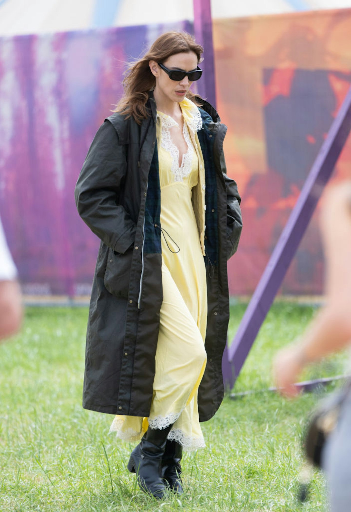 Alexa Chung in a waxed Barbour coat at Glastonbury