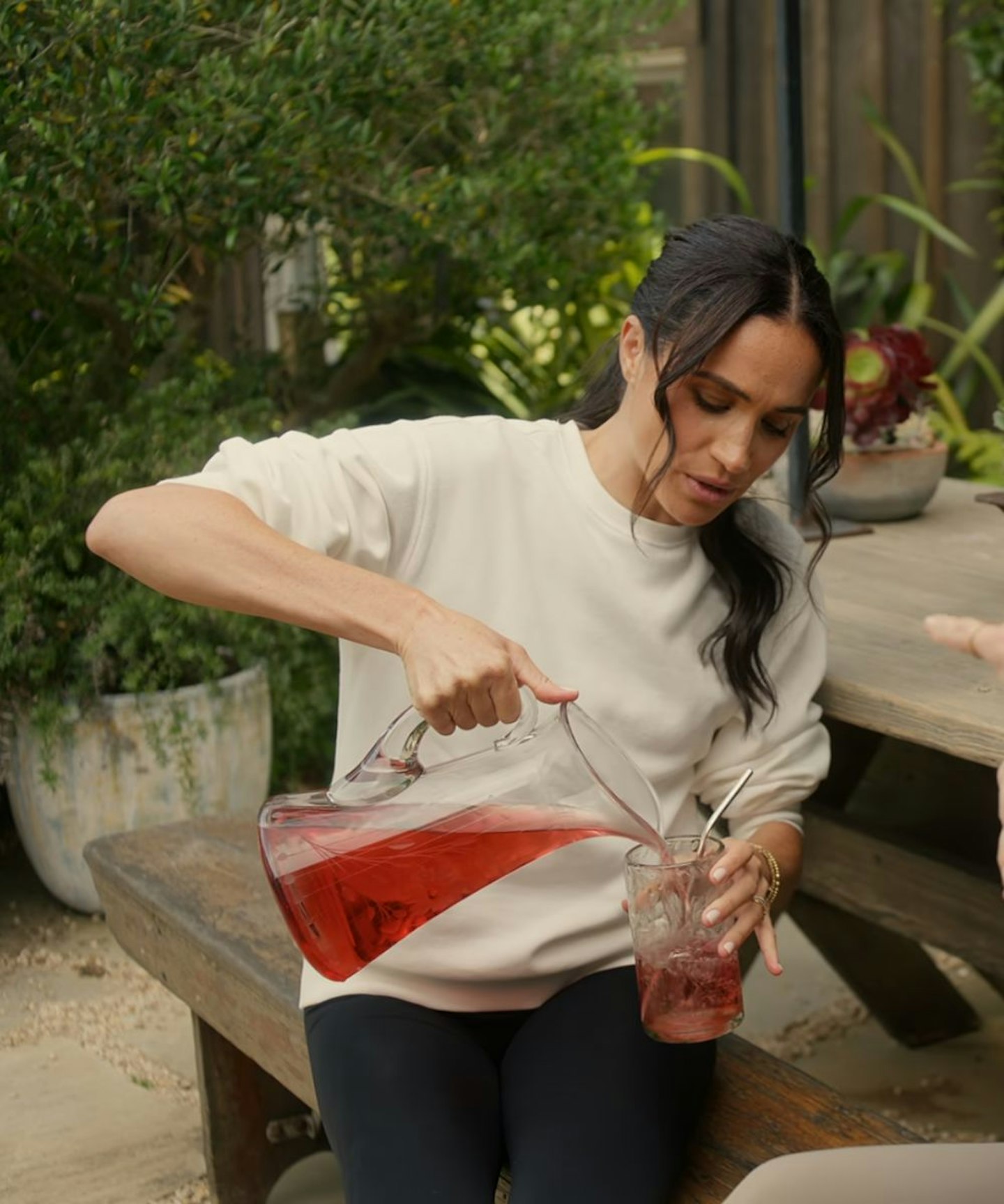 Meghan Markle wearing a cream crewneck sweatshirt on Netflix's With Love, Meghan