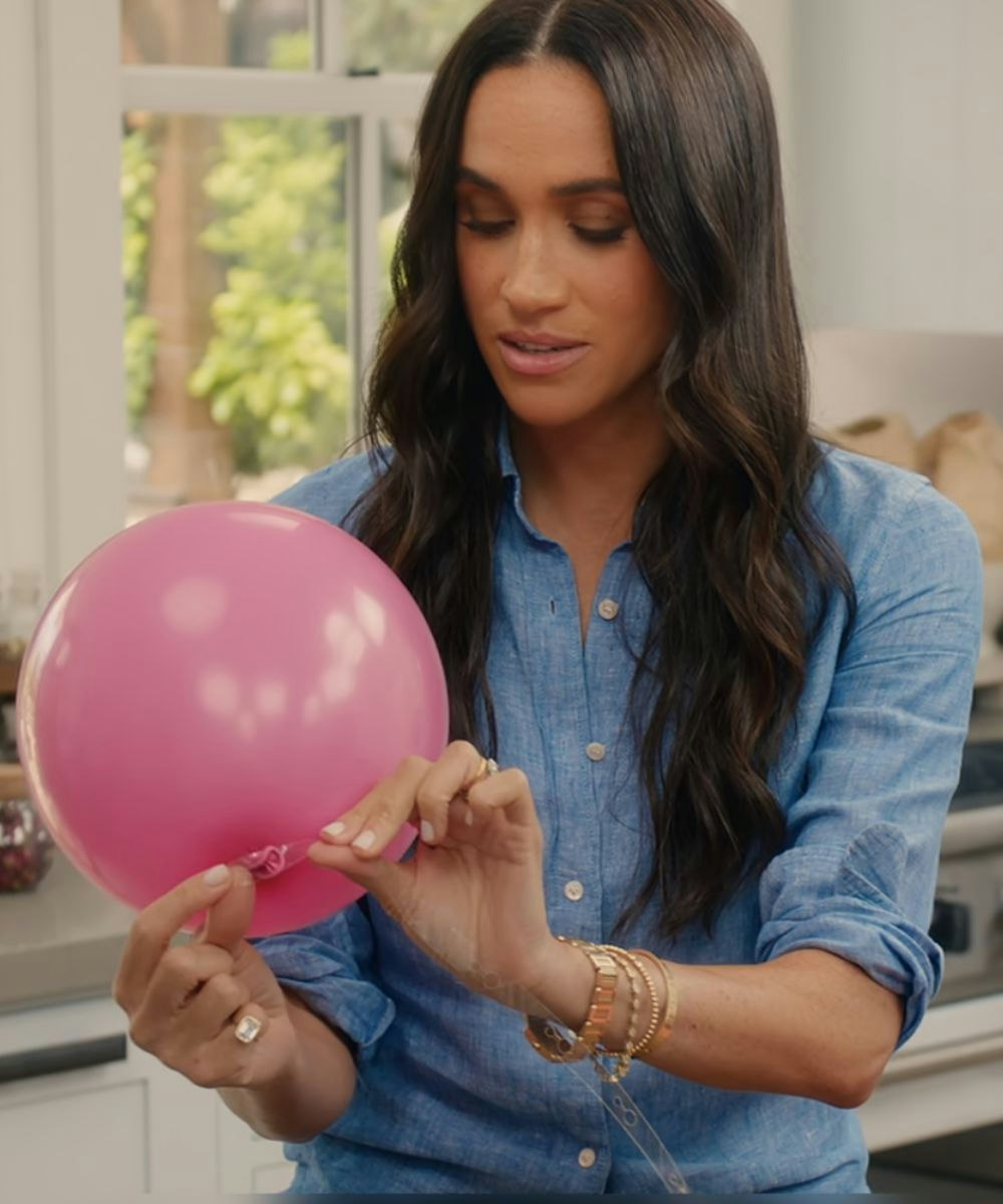 Meghan Markle wearing Cartier tank francaise watch and tennis bracelet on Netflix