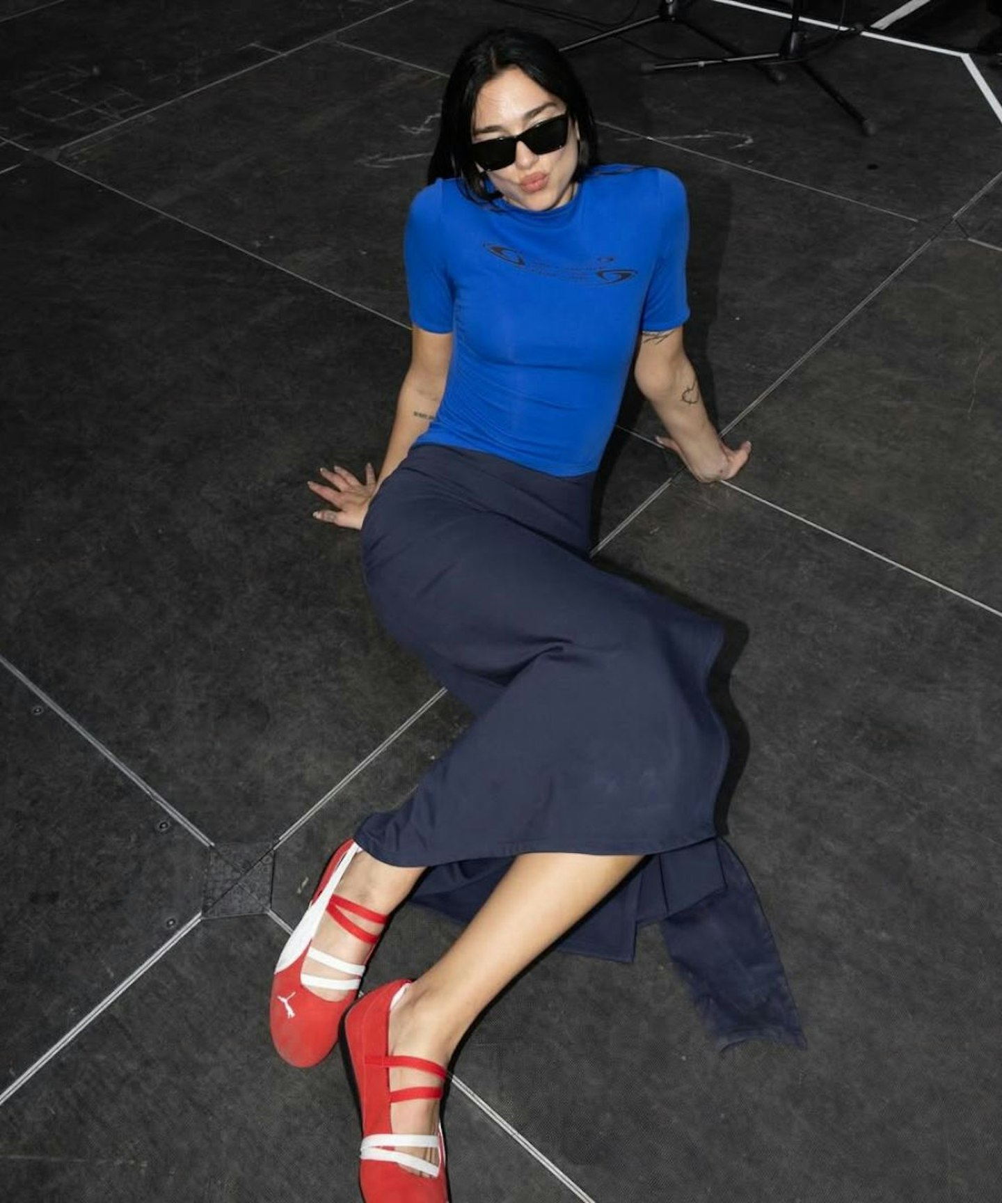 dua lipa wearing puma's speedcat ballerina sneakers