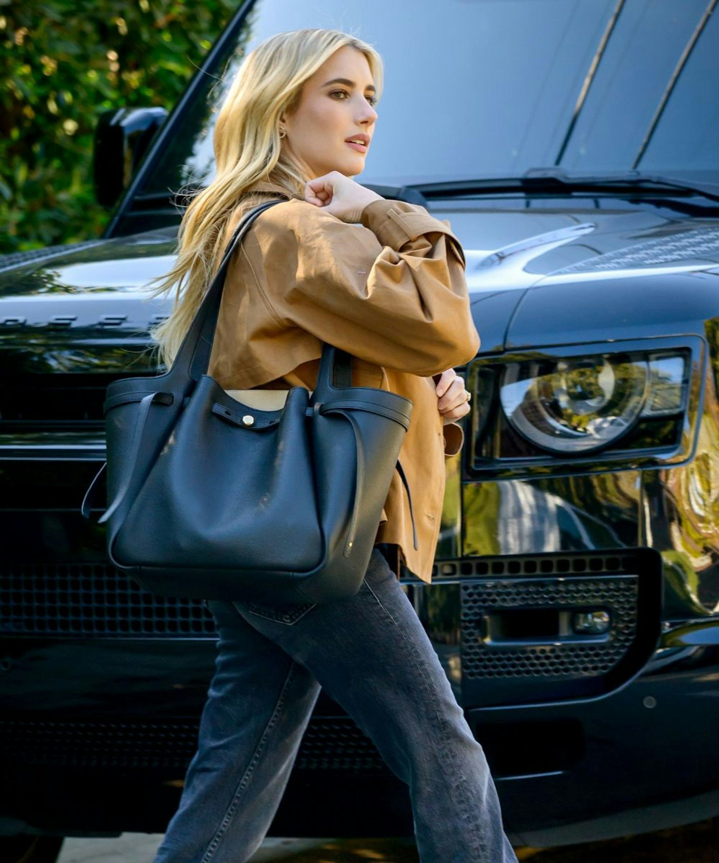 Emma Roberts carrying the Tory Burch Romy bag