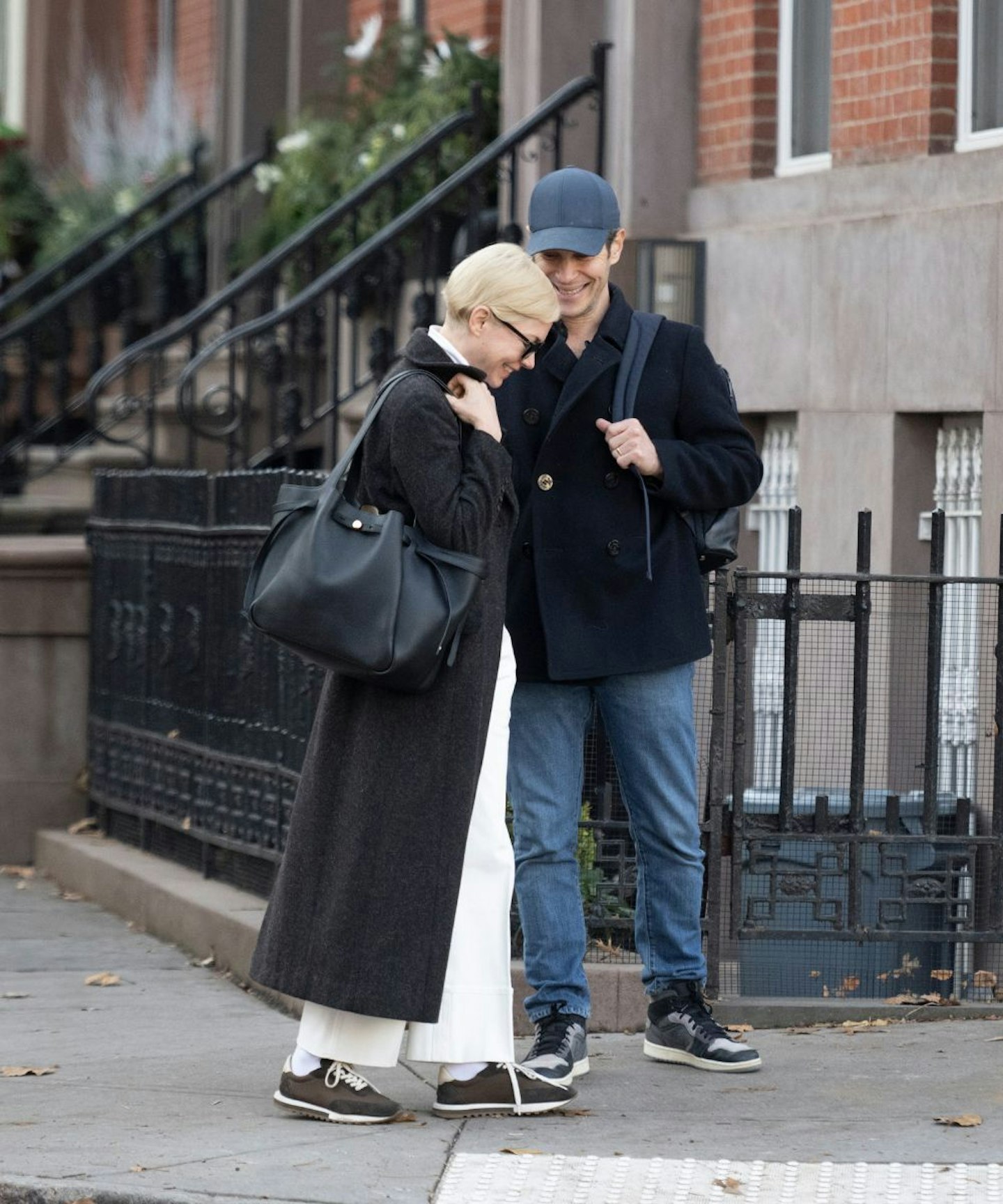 Michelle Williams carrying the Tory Burch Romy bag