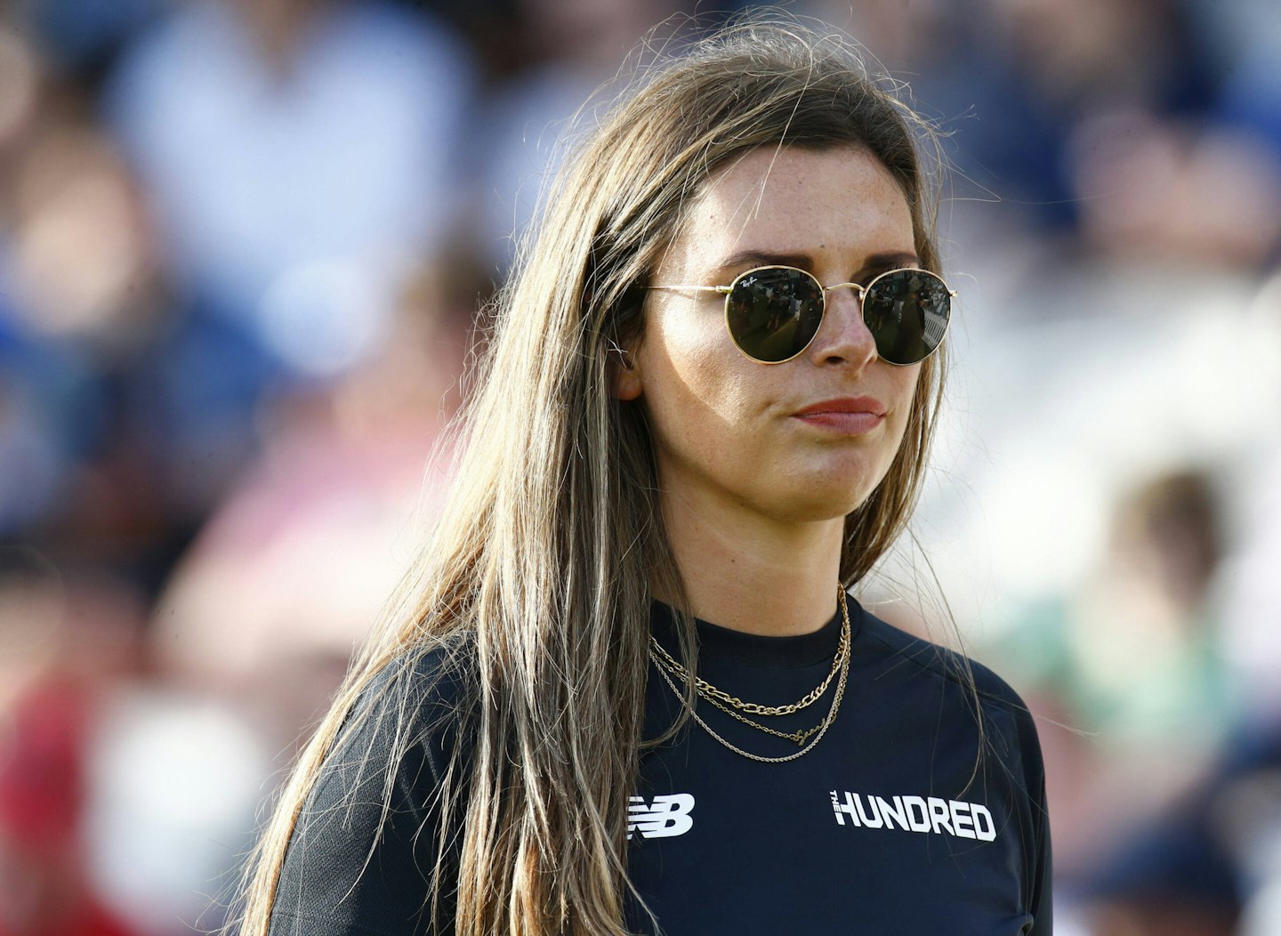 Emma Saunders wears black t-shirt and sunglasses