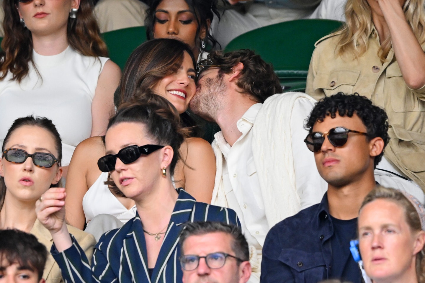 Andrew Garfield plants a kiss on girlfriend Monica Barbaro's cheek on 6 July at Wimbledon