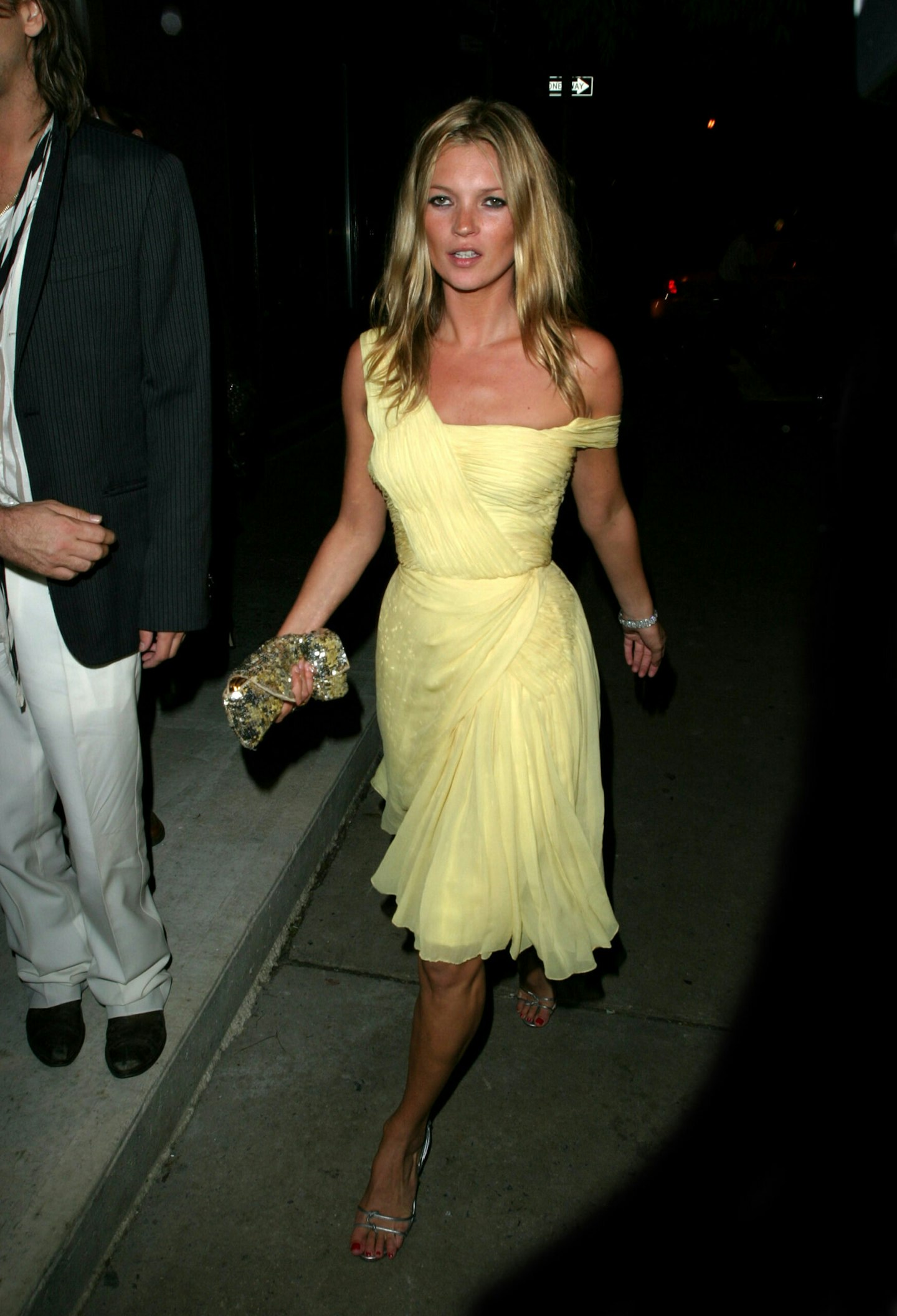 Kate Moss in a vintage yellow dress that inspired a best-seller in her Topshop collection