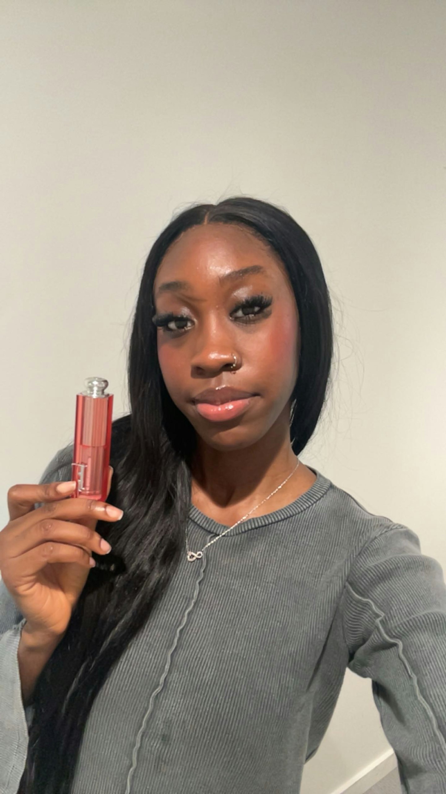 Fashion and beauty digital writer, Renee Washington, using the Dior Rosy Glow Stick
