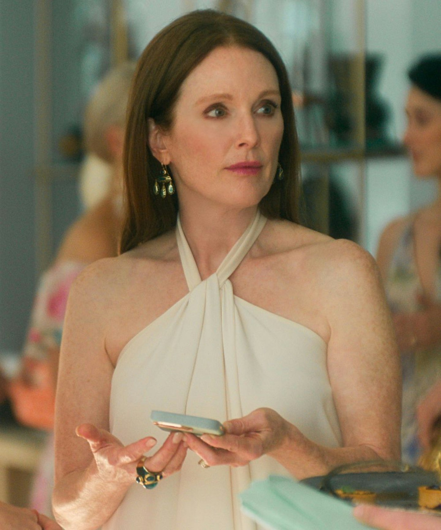 Netflix's sirens outfits Julianne Moore wearing a white halter neck dress