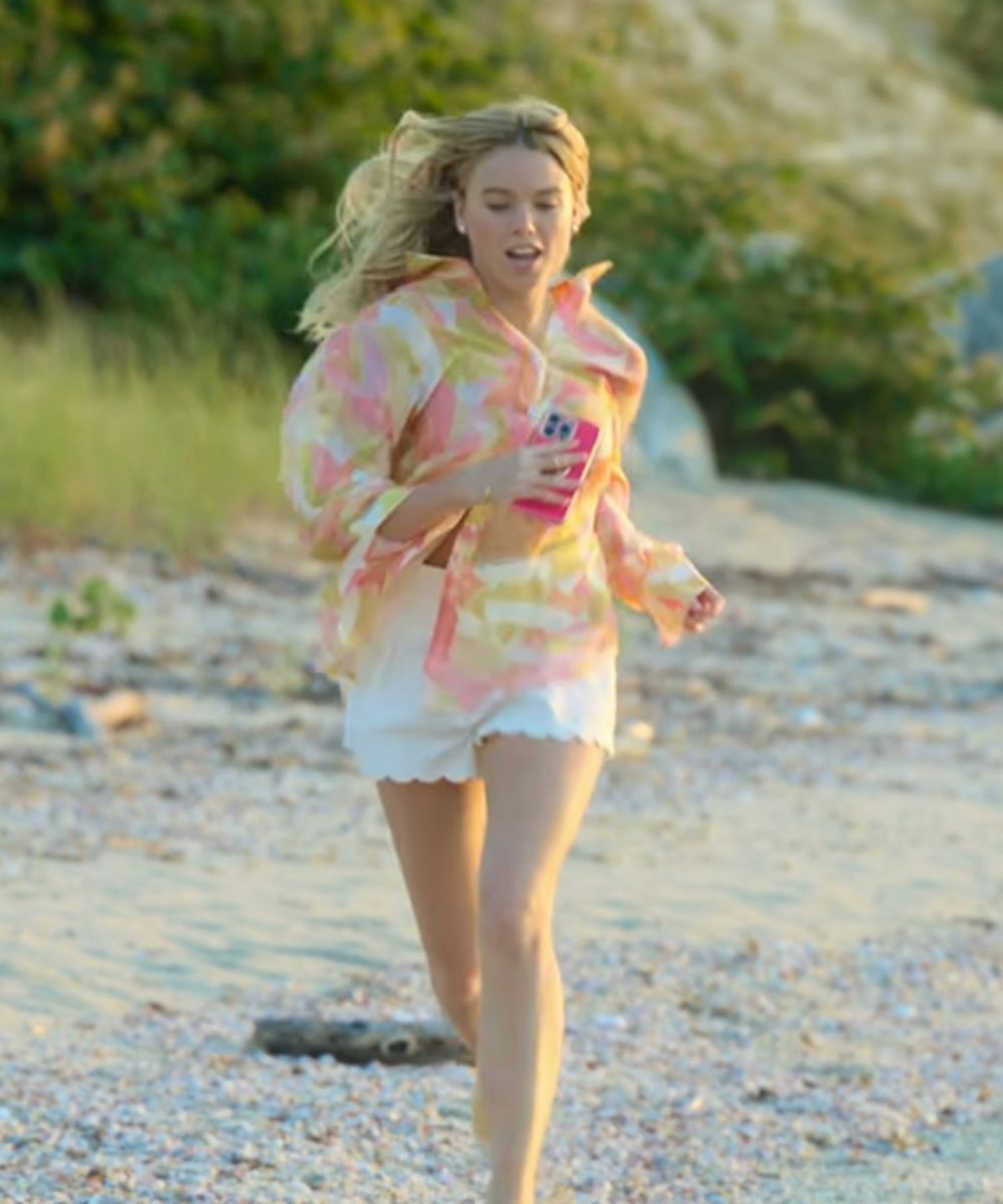 Netflix's sirens outfits Milly Alcock as Simone wearing scalloped shorts and a printed shirt