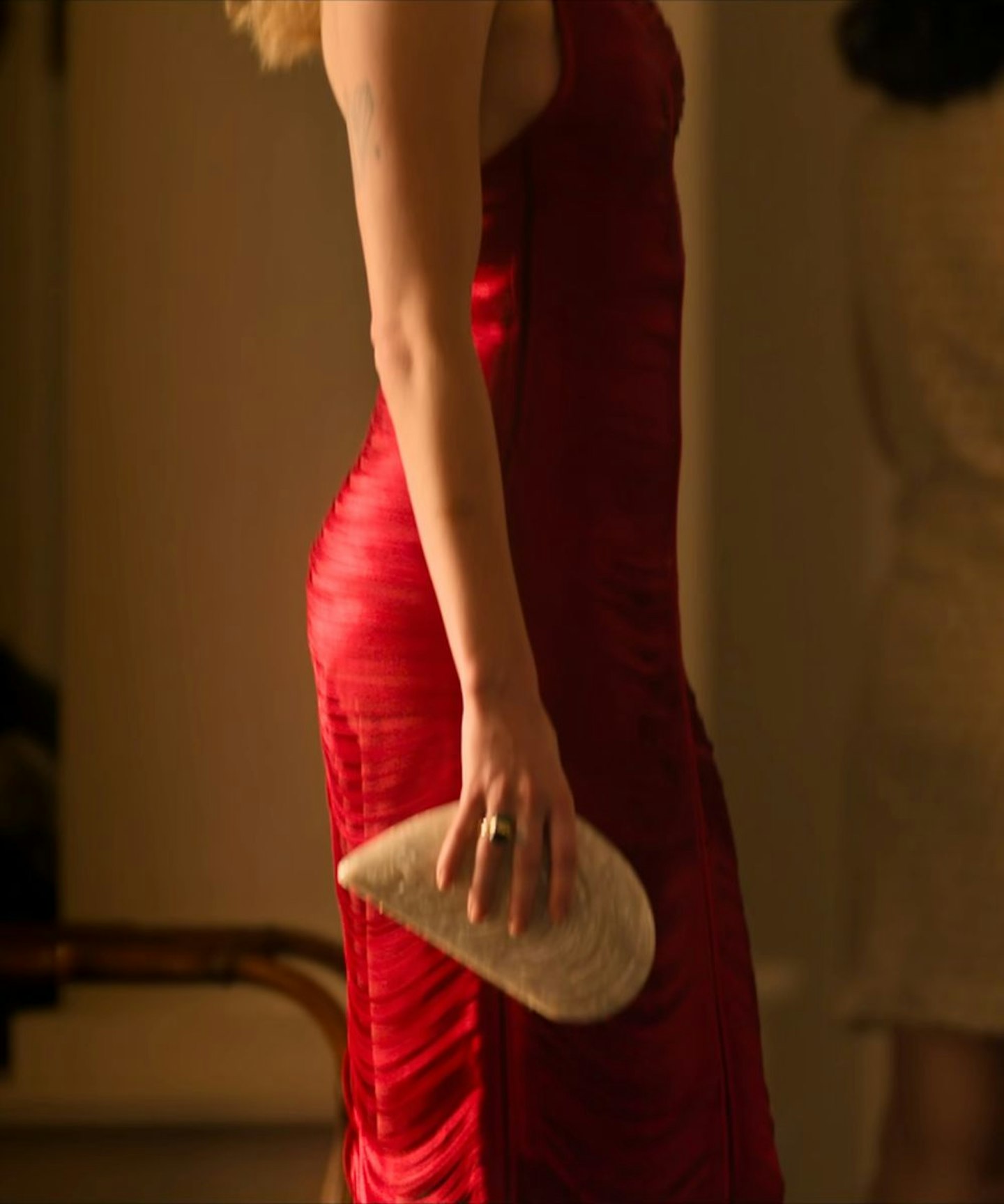 Netflix's sirens outfits Meghann fahy as Devon carrying a simkhai metal shell clutch bag