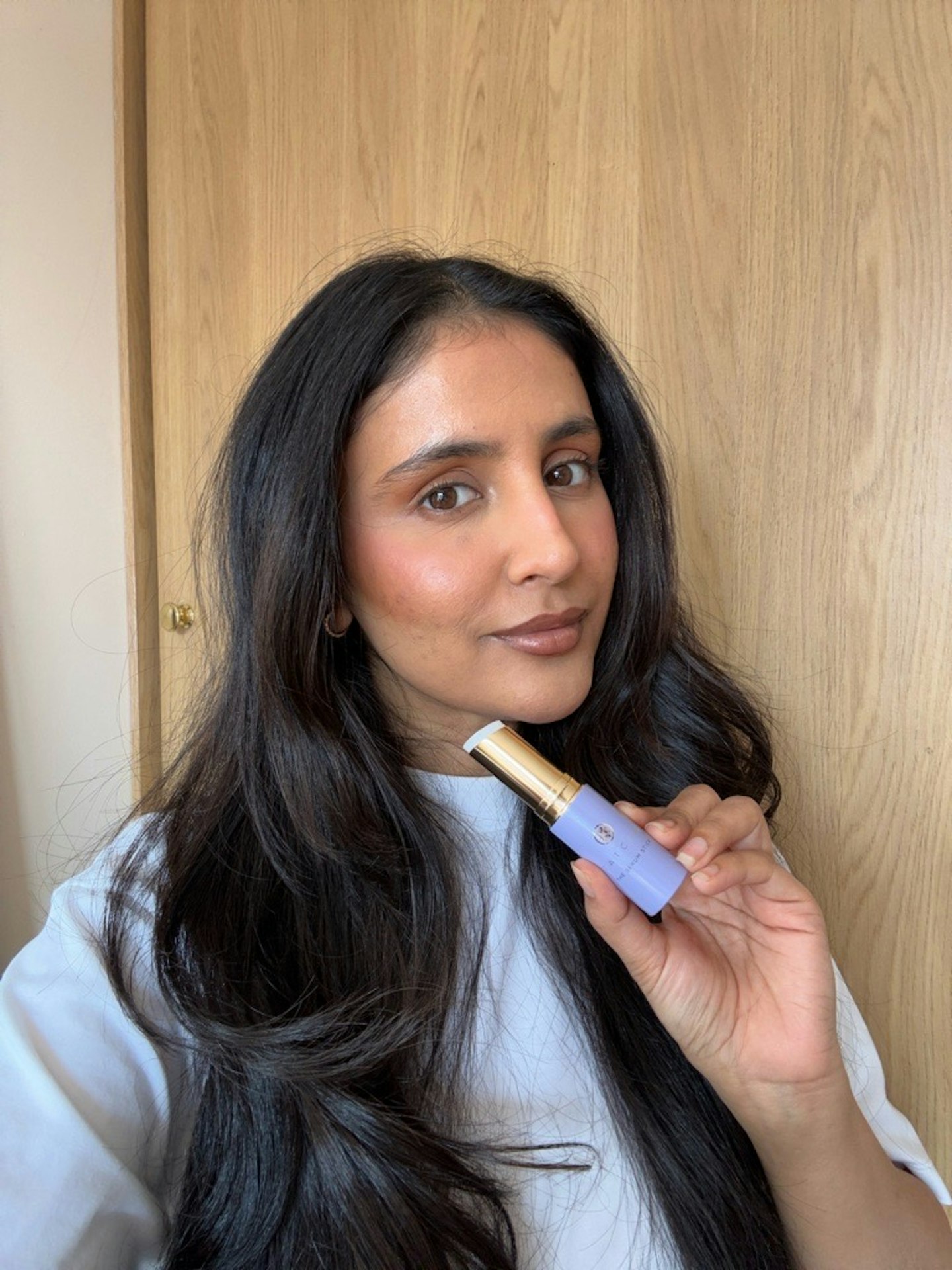 Sameeha Shaikh, beauty writer, using the Tatcha the Serum Stick