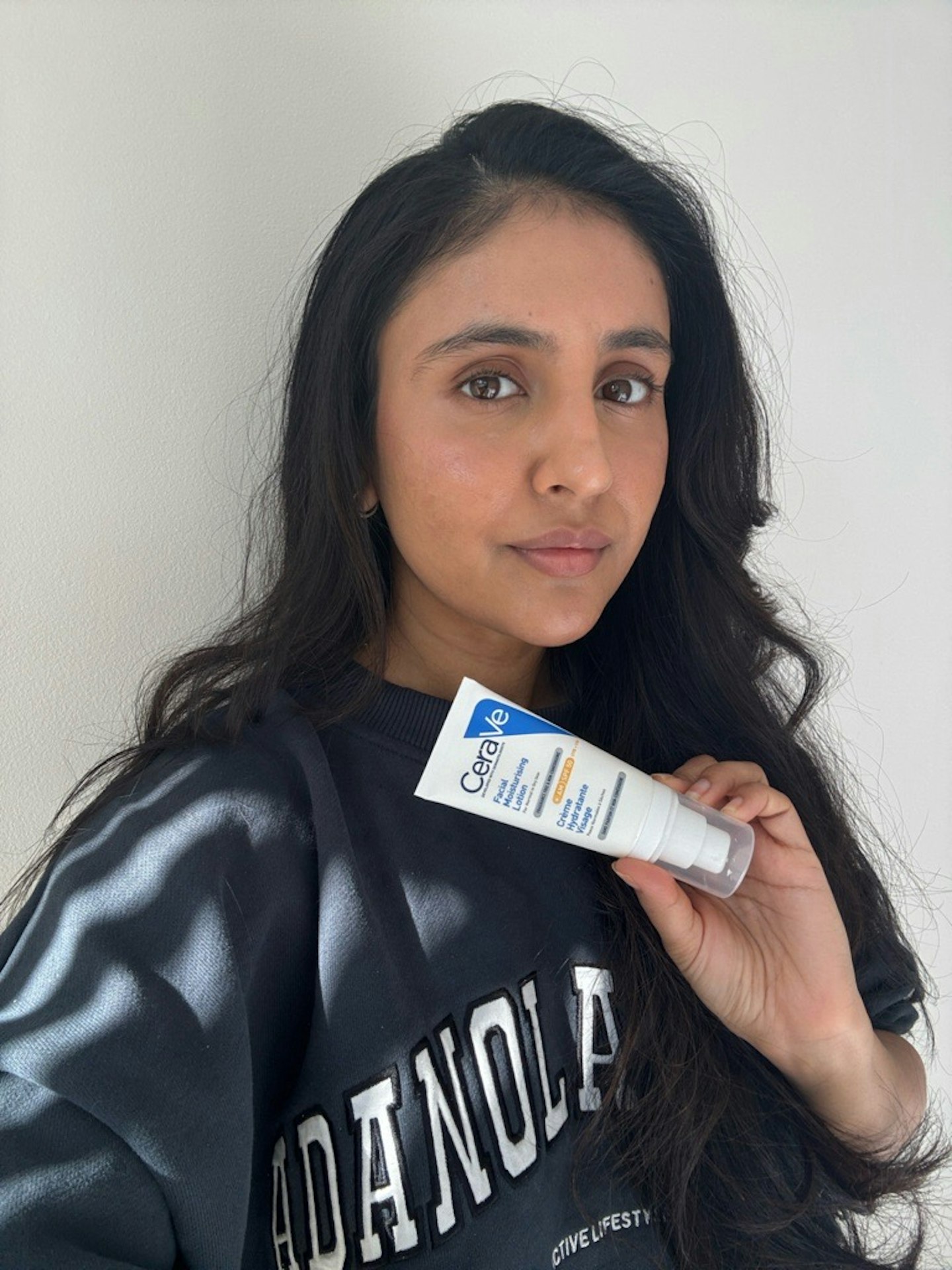 Sameeha Shaikh, beauty writer, using the CeraVe Day Facial Moisturising Lotion