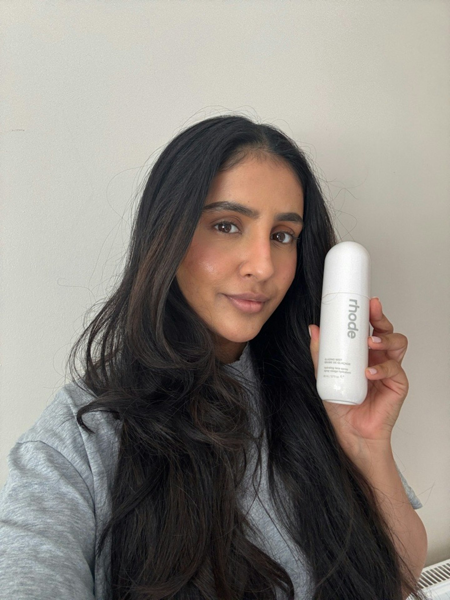 Sameeha Shaikh, beauty writer using Rhode's new Glazing Mist