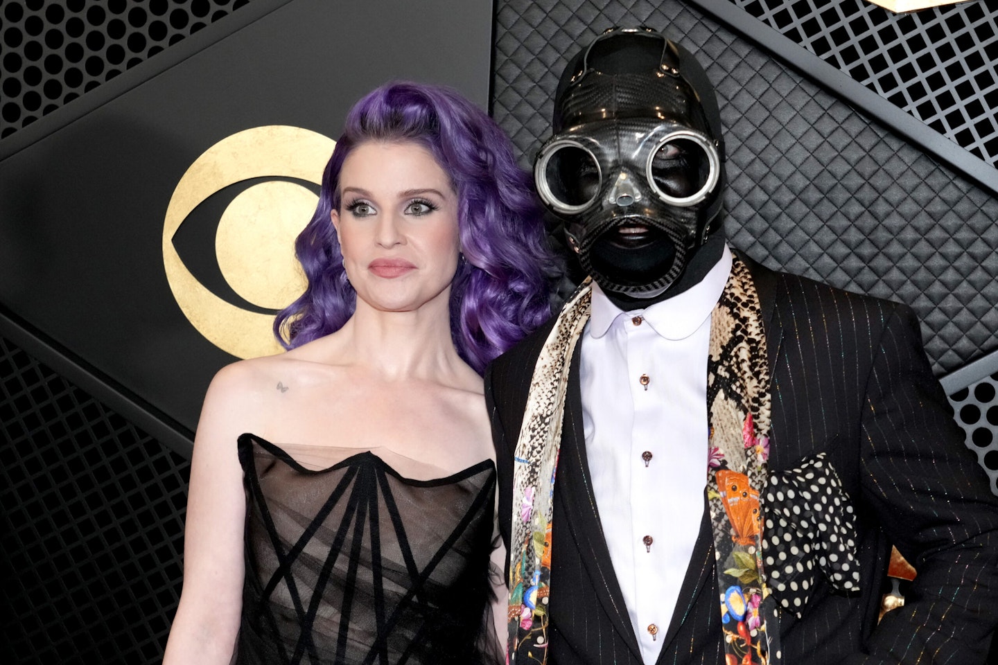 As part of Slipknot, Sid Wilson often dons a gas mask. Pictured here with Kelly Osbourne at the 66th Grammy Awards in February 2024
