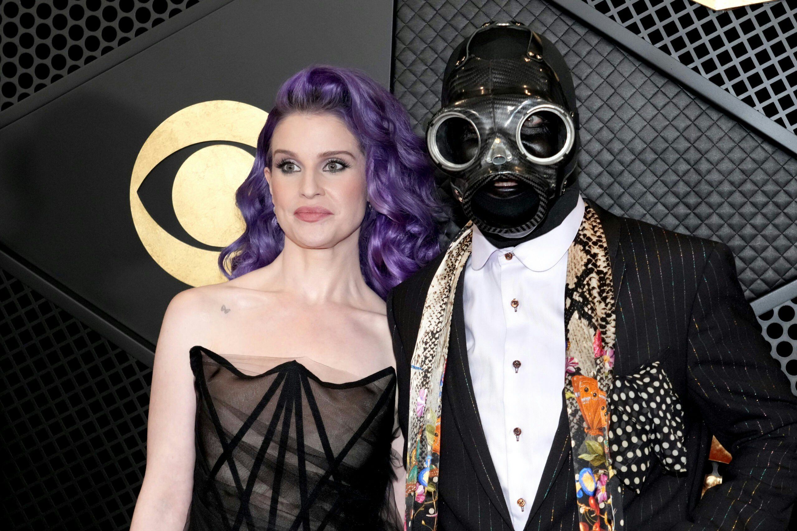 As part of Slipknot, Sid Wilson often dons a gas mask. Pictured here with Kelly Osbourne at the 66th Grammy Awards in February 2024