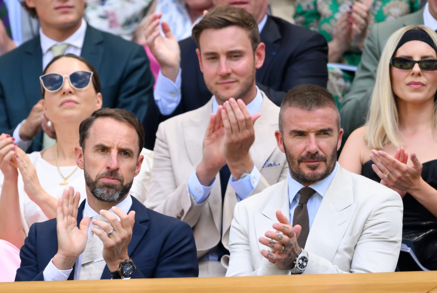 The Saturday's Mollie King and husband, former Cricketer Stuart Broad sitting behind Sir Gareth Southgate and Sir David Beckham