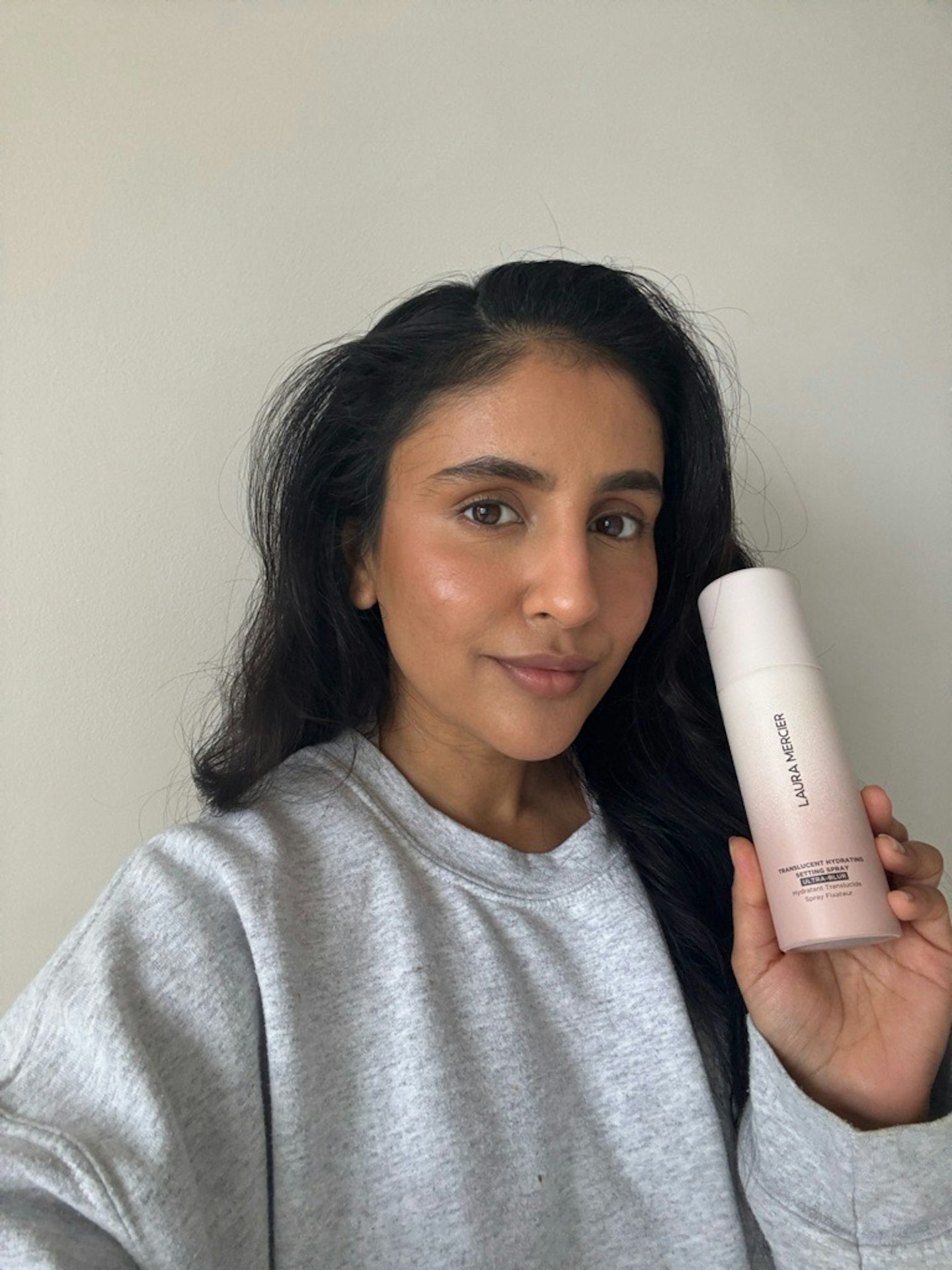 Sameeha Shaikh, beauty writer, using the Laura Mercier Translucent Hydrating Setting Spray Ultra-Blur