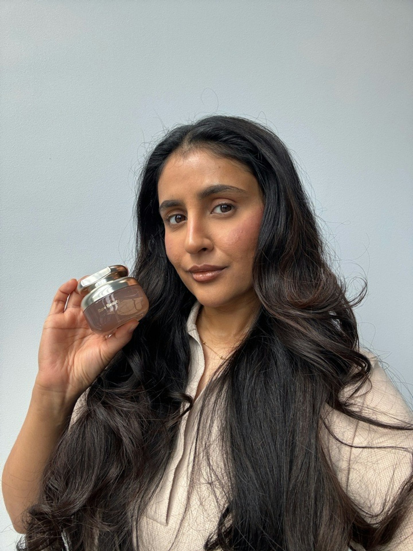 Sameeha Shaikh, beauty writer, using the new Rare Beauty fragrance
