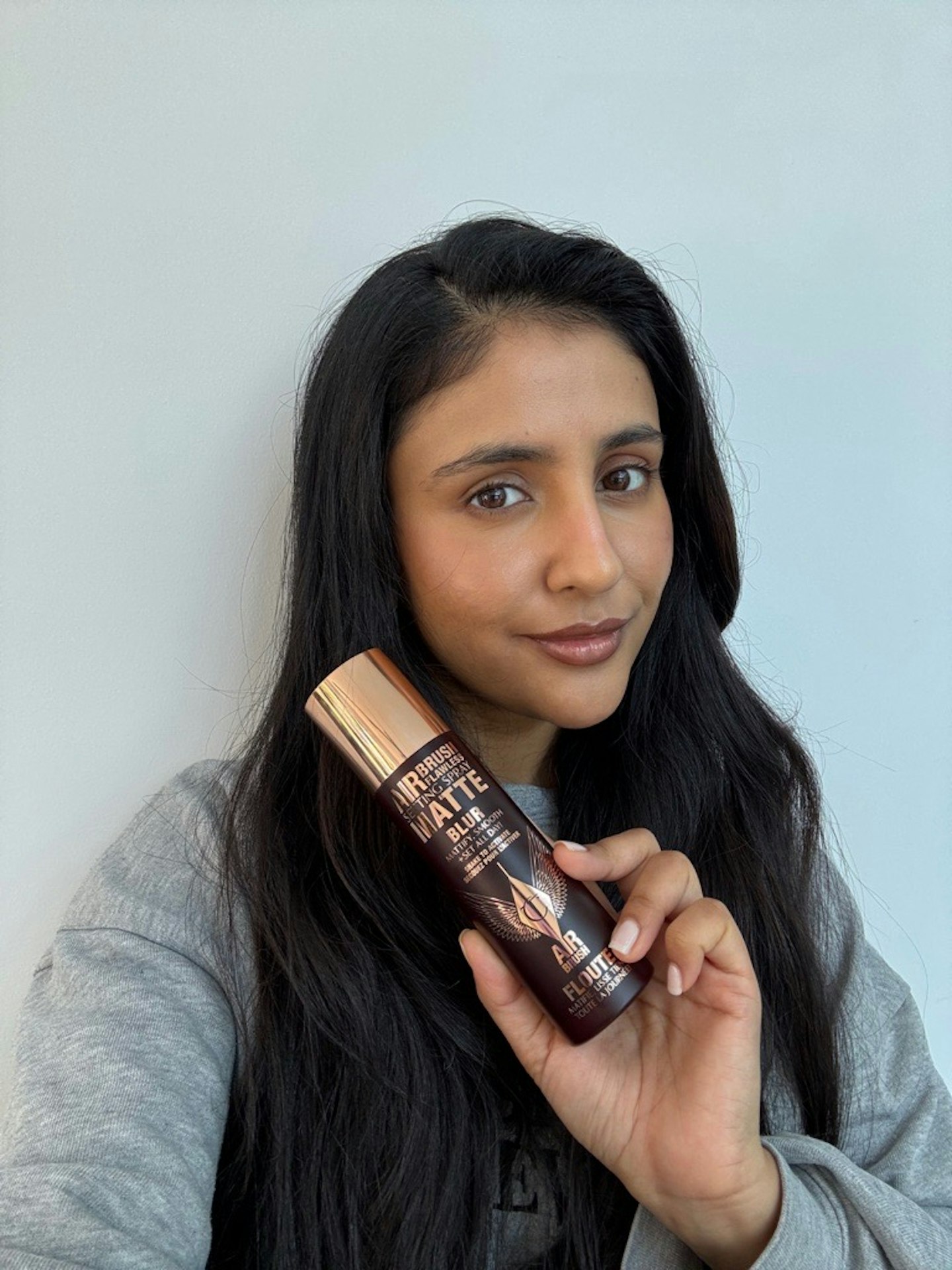 Sameeha Shaikh, beauty writer, using the Charlotte Tilbury Airbrush Flawless Setting Spray Matte