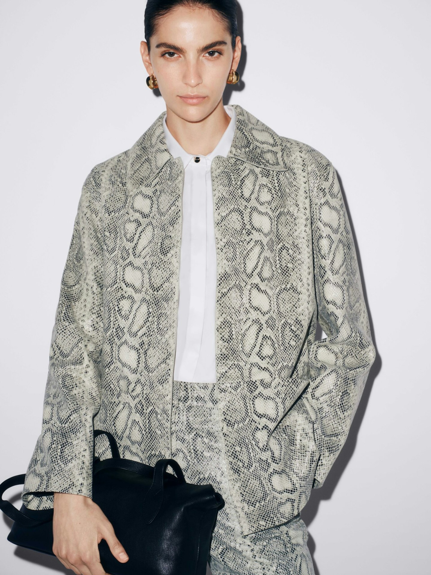 M&S Autograph Snake Jacket £299, Silk Shirt £90, Snake Trouser £250, Leather Bowler Bag