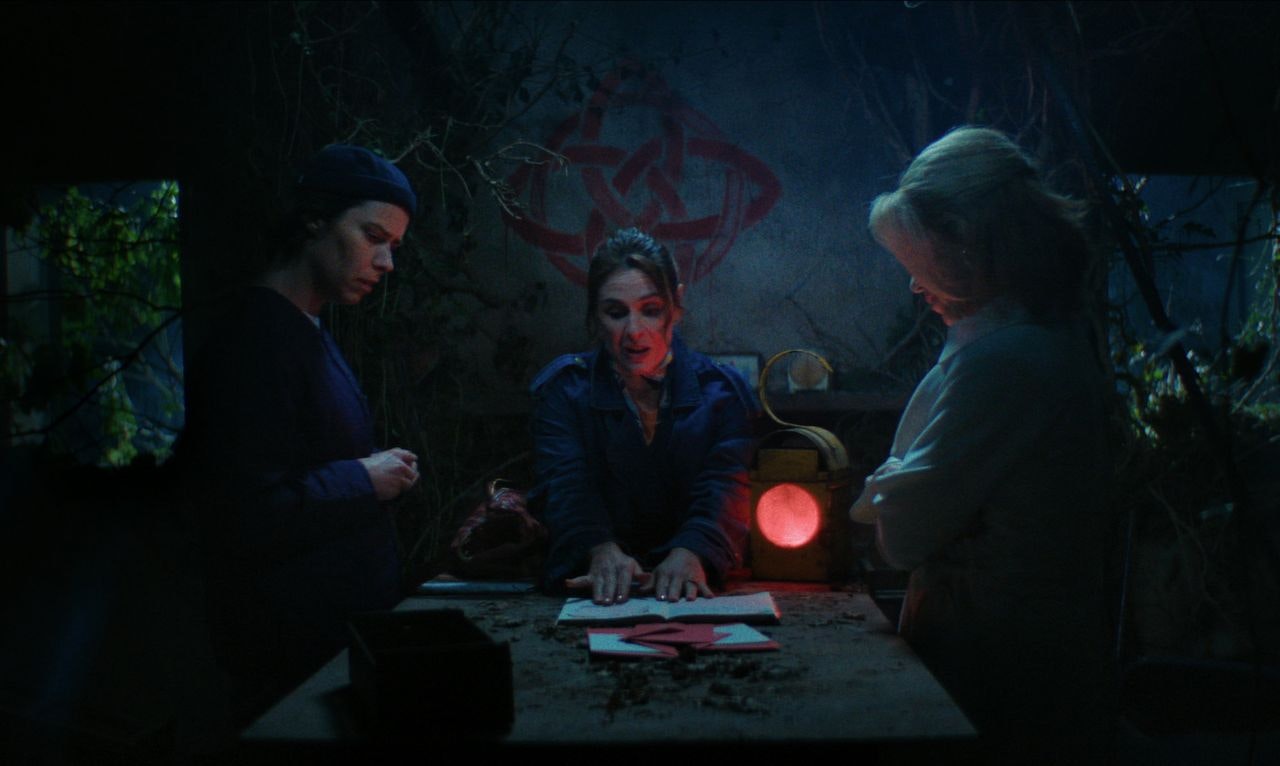 How to get to heaven from belfast - three women sat around a table in the dark