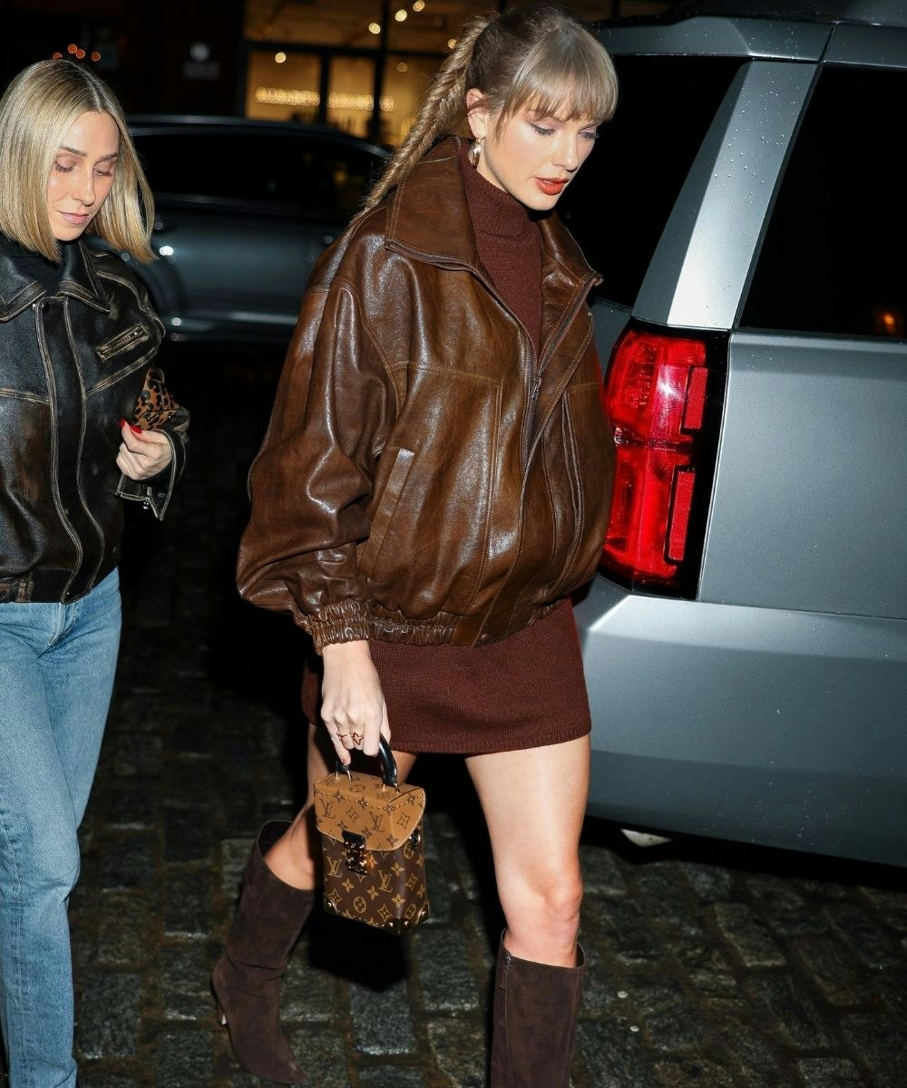 Taylor Swift wearing a brown winter outfit