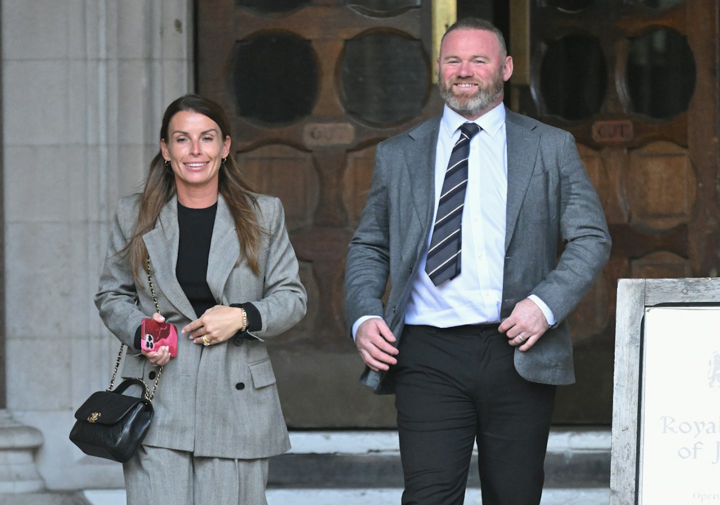 Coleen Rooney and Wayne Rooney leaving court