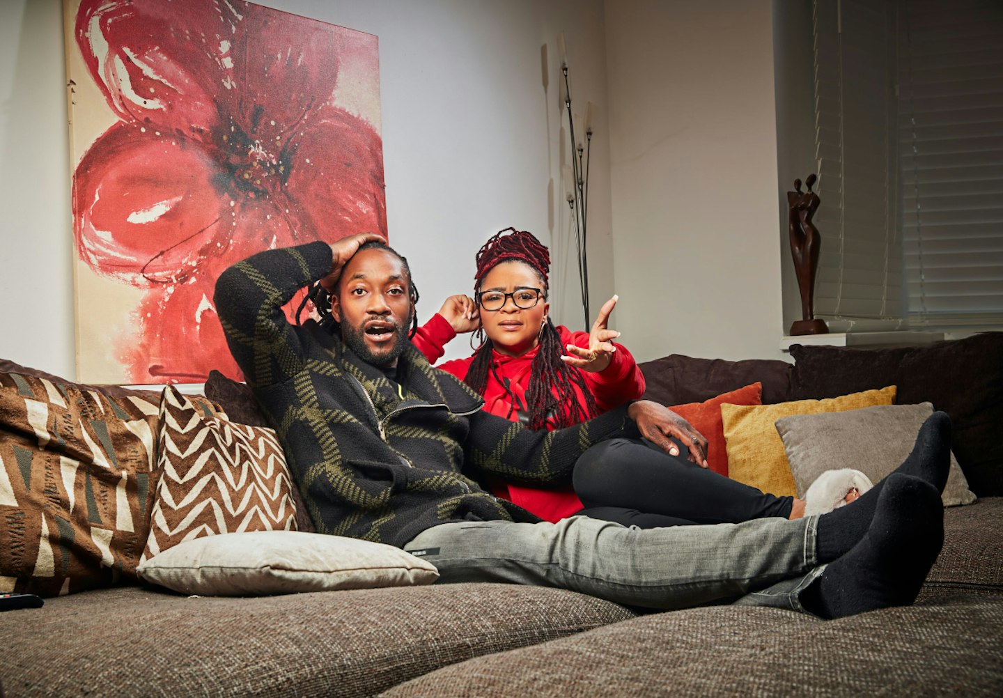 Gogglebox's Marcus and Mica sitting on their sofa