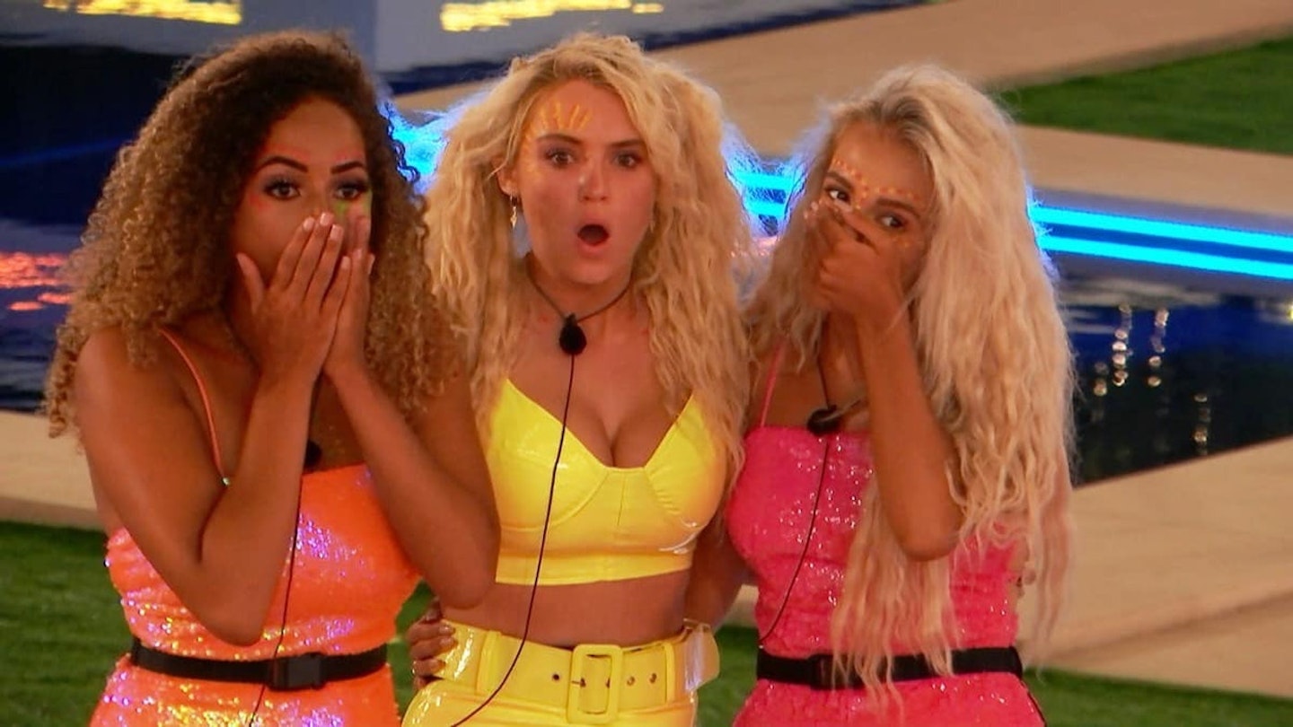 Amber Gill, Lucie Donlan and Molly-Mae Hague looking shocked in the Love Island villa