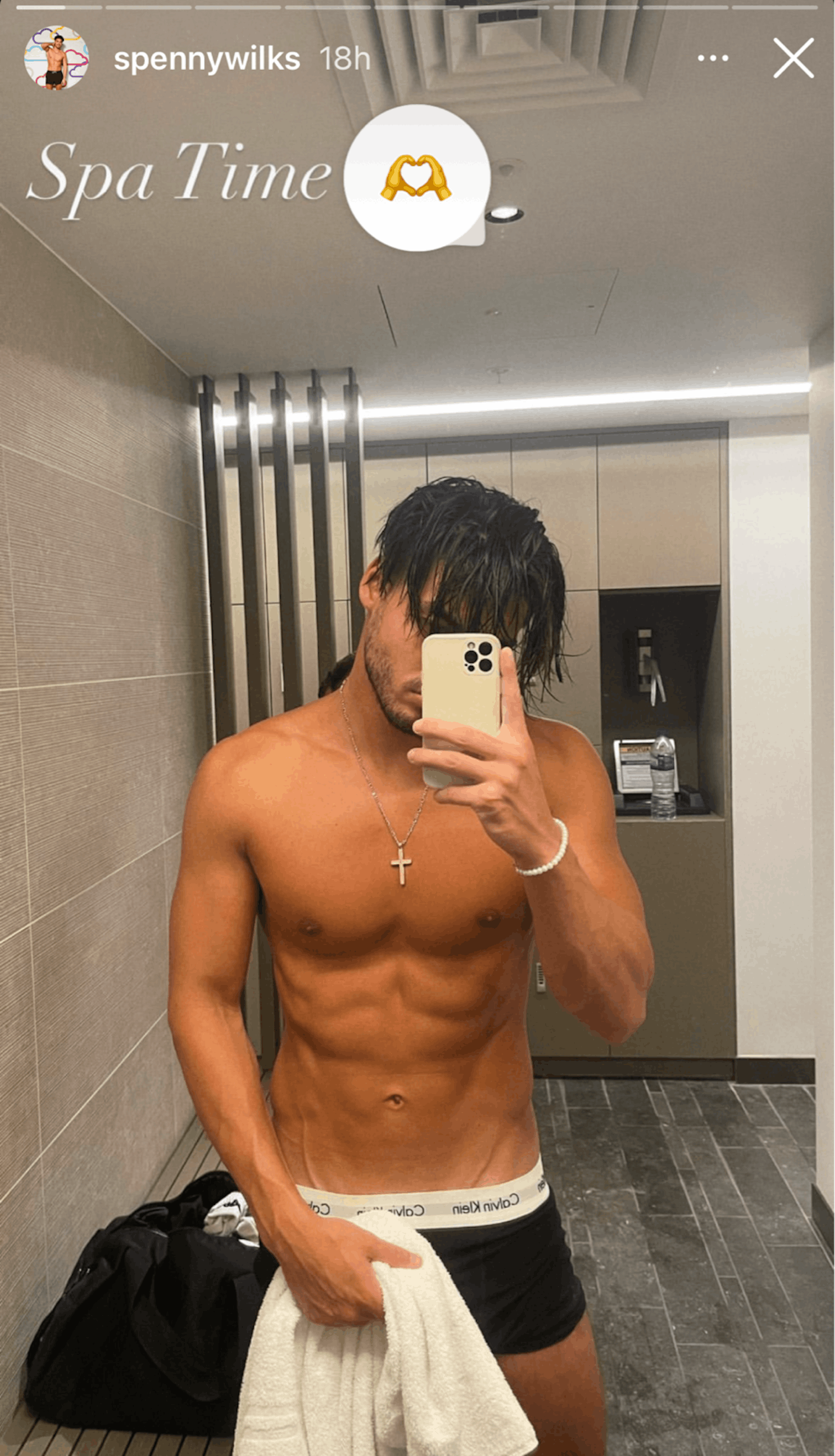 Topless Spencer Wilks taking a mirror selfie