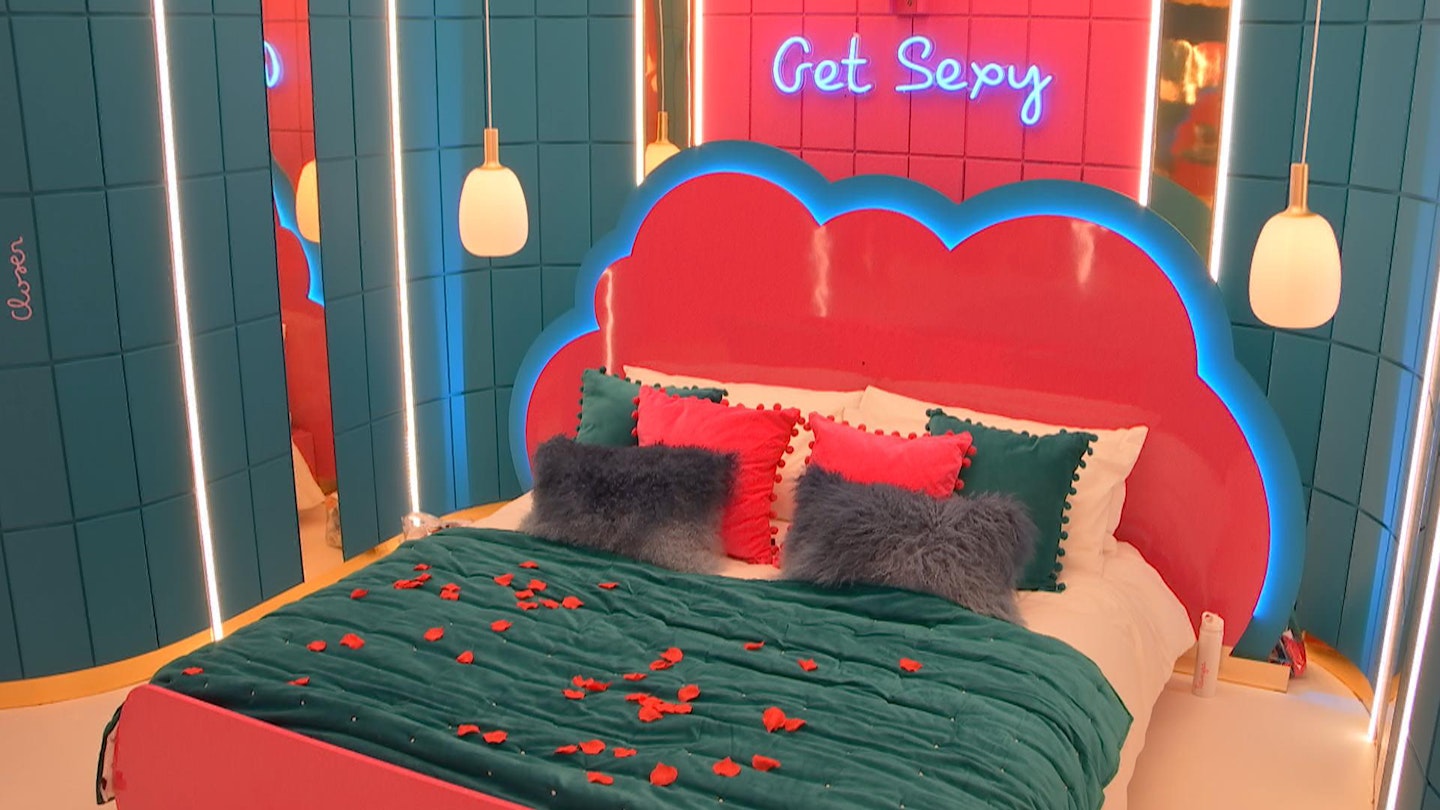 Love Island Hideaway bed covered in rose petals