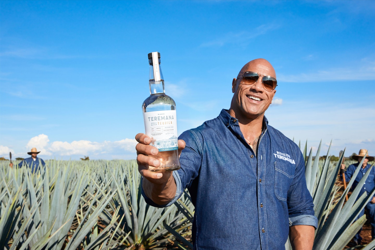 the Rock holds tequila