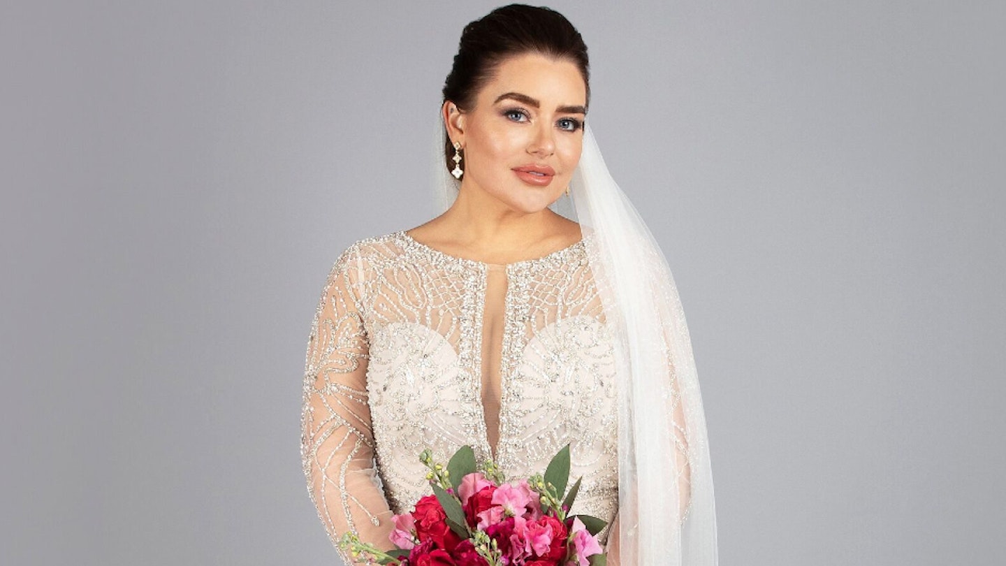 Married At First Sight UK's Amy Christophers in a wedding dress holding flowers