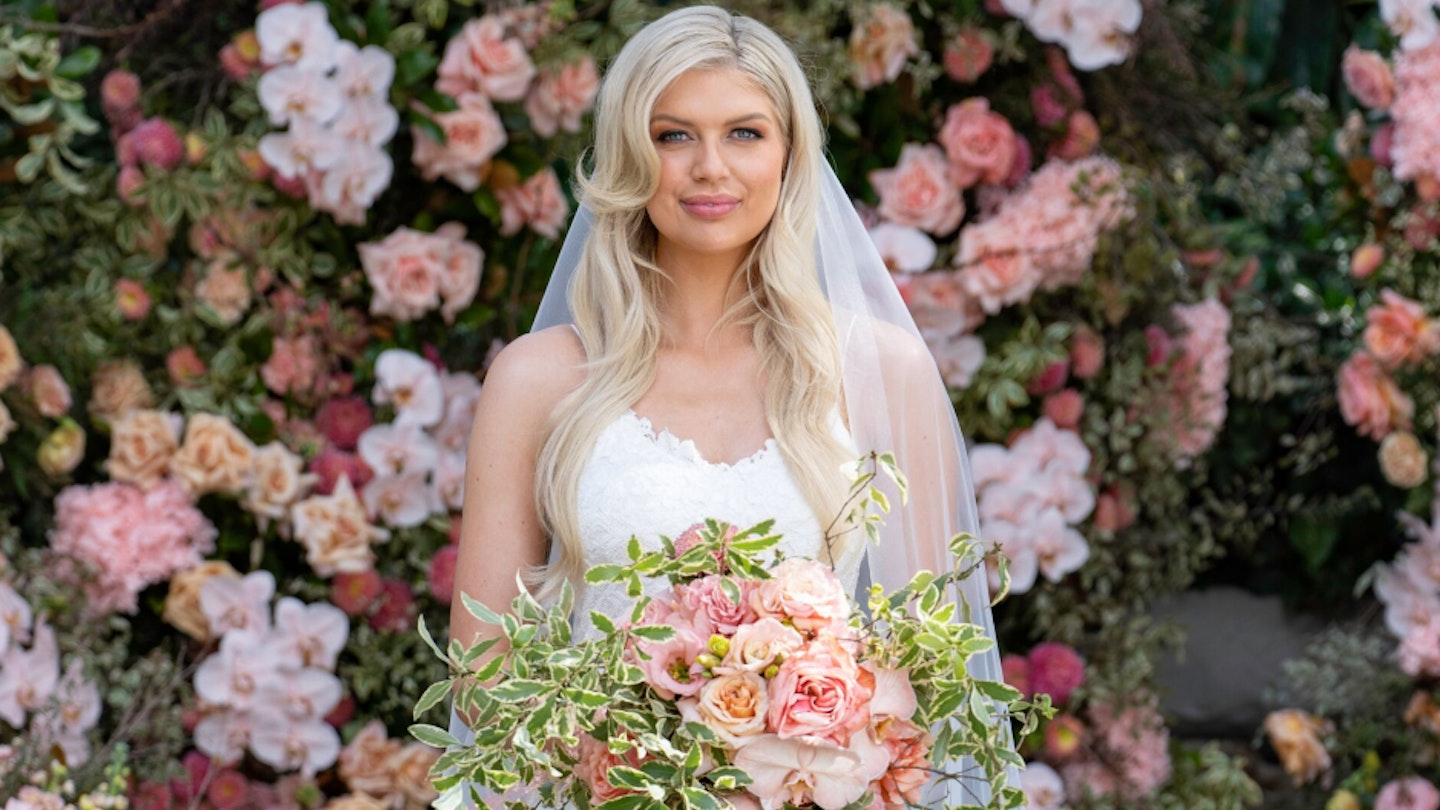 Caitlin from Married At First Sight Australia in a wedding dress holding a bouquet of flowers