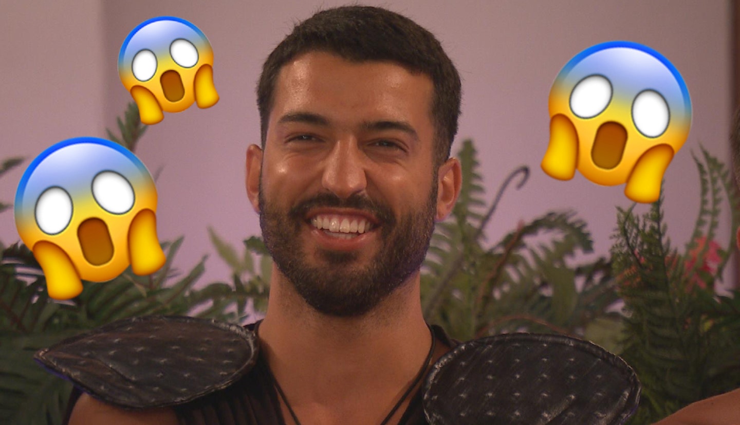 Medhi Edno sitting at the fire pit during the Love Island heart rate challenge with one small and two big shocked emojis around his face