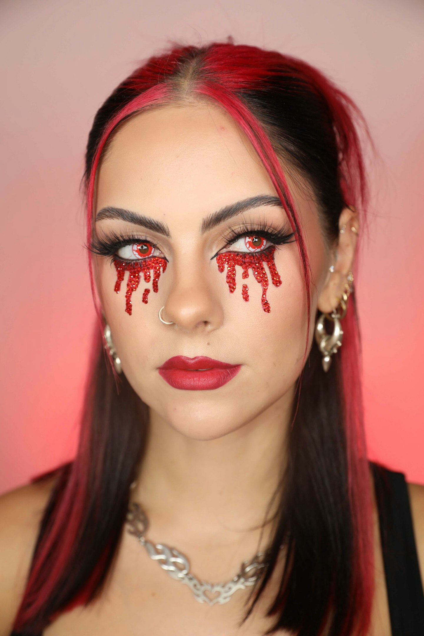 Rhinestone bleeding eye makeup look